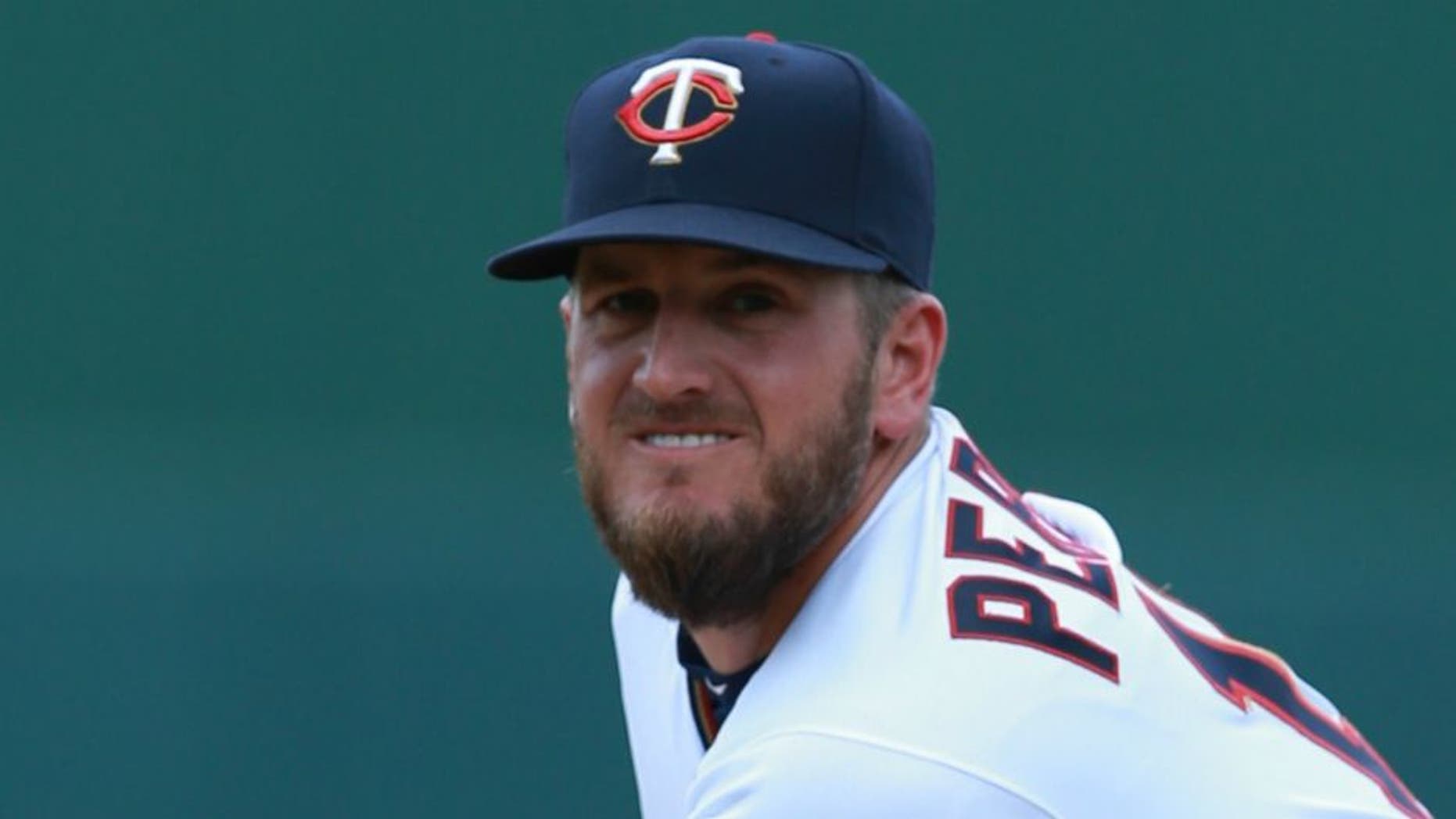 Mar 23, 2016; Fort Myers, FL, USA; Minnesota Twins relief pitcher Glen Perkins (15) throws a warm up pitch during the seventh inning against the Tampa Bay Rays at CenturyLink Sports Complex. Mandatory Credit: Kim Klement-USA TODAY Sports