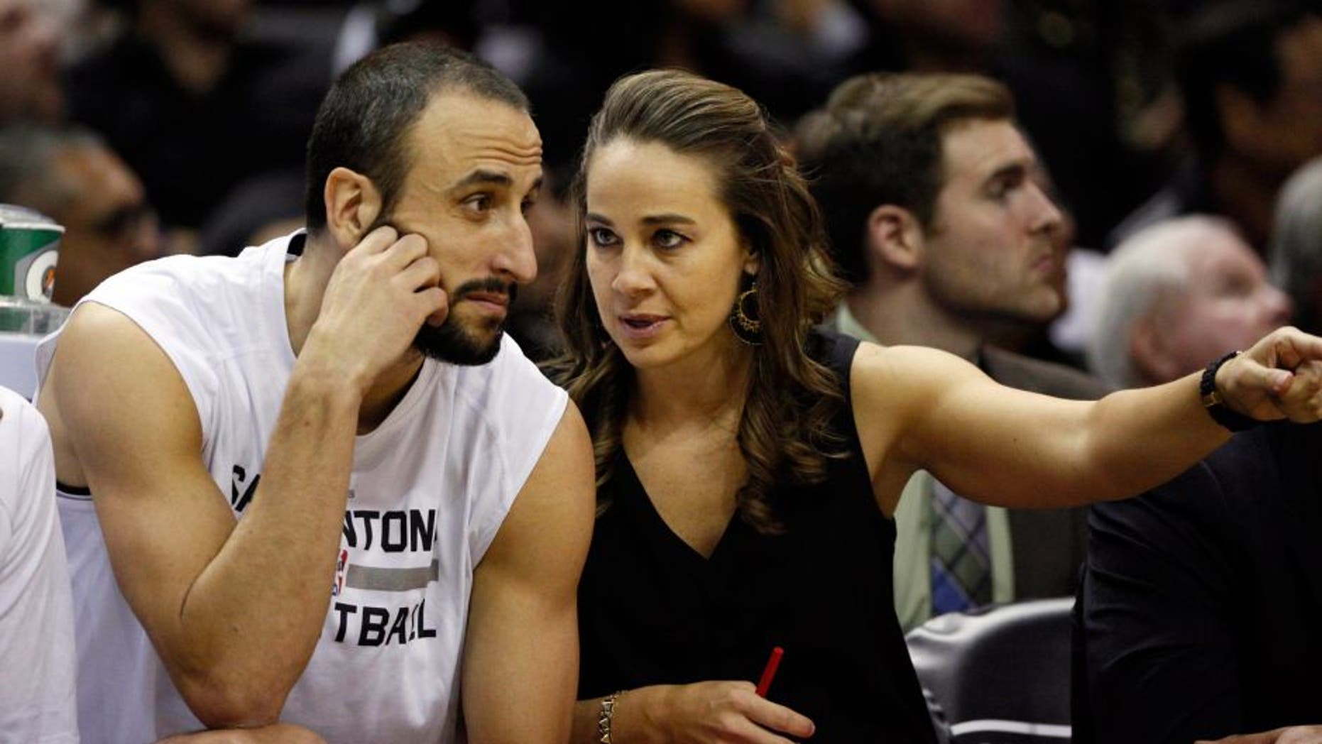 Nov 26, 2014; San Antonio, TX, USA; San Antonio Spurs assistant coach Becky Hammon (R) talks to shooting guard Manu Ginobili (20) during the first half against the Indiana Pacers at AT&T Center. Mandatory Credit: Soobum Im-USA TODAY Sports