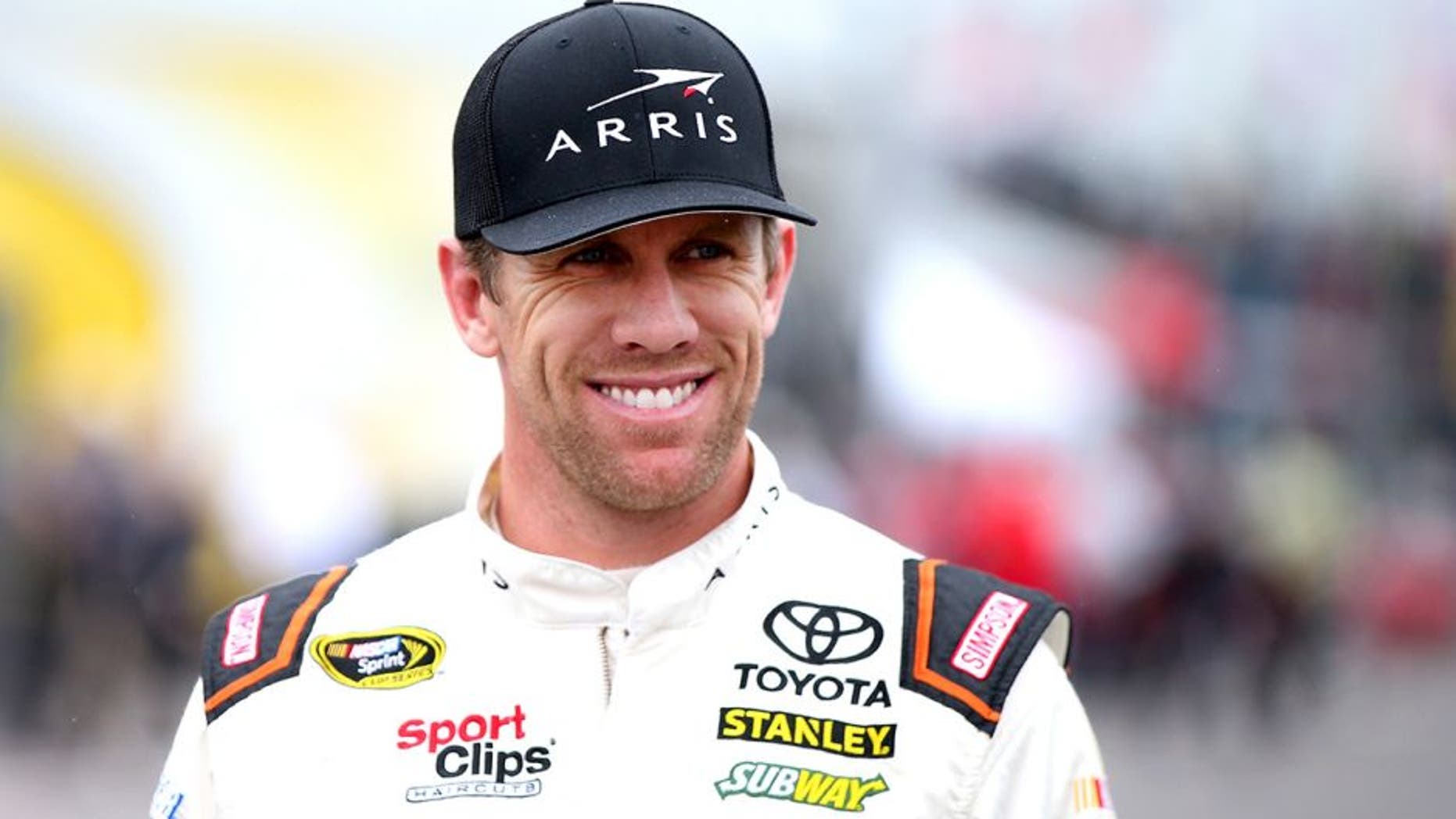 LONG POND, PA - JUNE 03: Carl Edwards, driver of the #19 ARRIS Toyota, stands in the garage area during practice for the NASCAR Sprint Cup Series Axalta "We Paint Winners" 400 at Pocono Raceway on June 3, 2016 in Long Pond, Pennsylvania. (Photo by Sean Gardner/Getty Images)