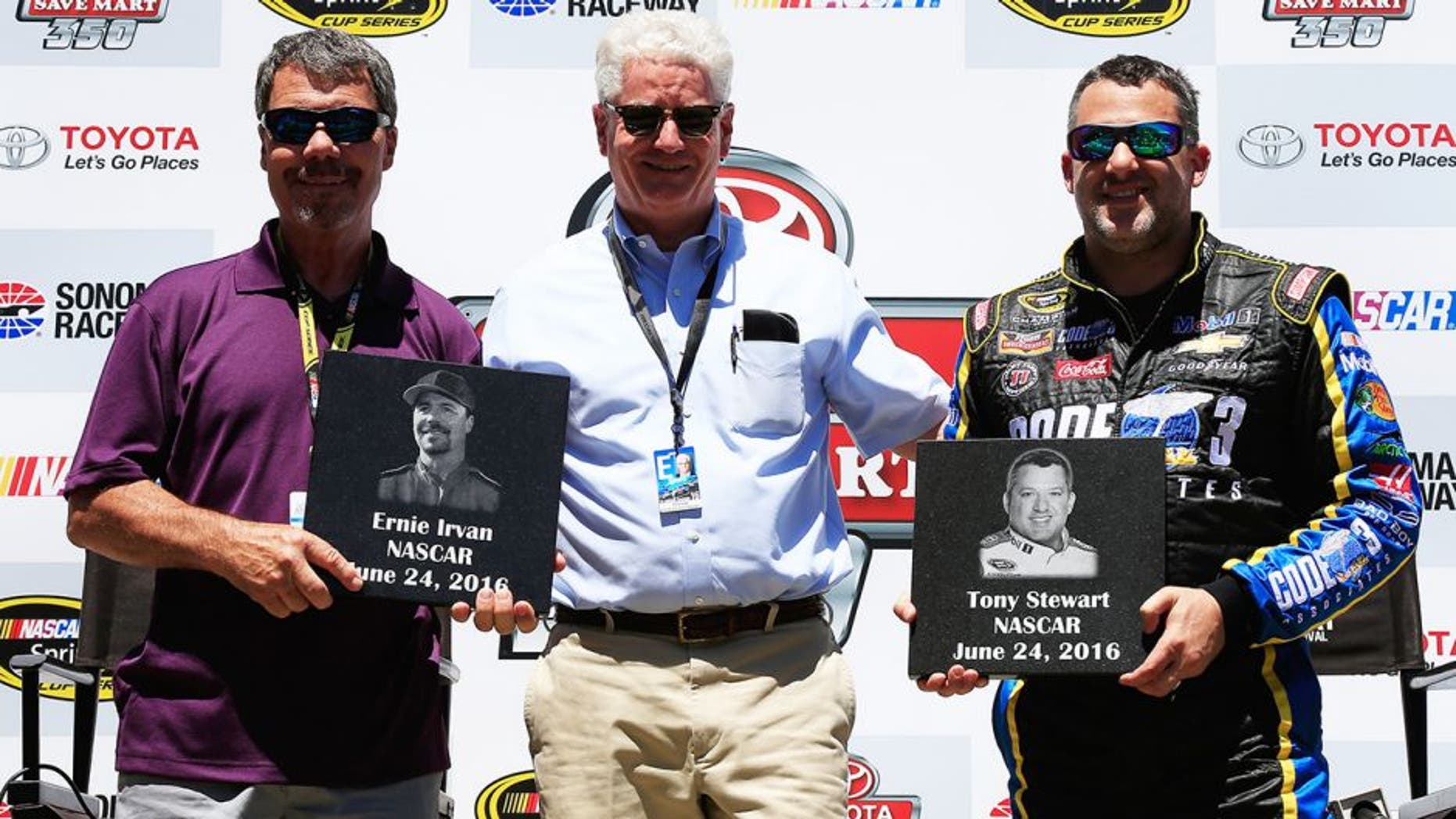 SONOMA, CA - JUNE 24: (L-R) Former driver Ernie Irvan and Tony Stewart, driver of the #14 Code 3 Assoc/Mobil 1 Chevrolet, are inducted into the Sonoma Raceway Wall Of Fame after practice for the NASCAR Sprint Cup Series Toyota/Save Mart 350 at Sonoma Raceway on June 24, 2016 in Sonoma, California. (Photo by Chris Trotman/NASCAR via Getty Images)