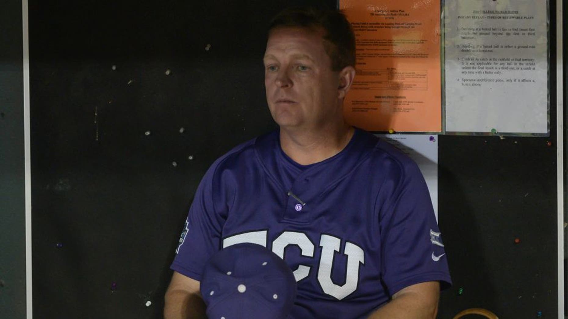 Jun 25, 2016; Omaha, NE, USA; TCU Horned Frogs head coach Jim Schlossnagle (22) looks out over the field after the loss against the Coastal Carolina Chanticleers in the 2016 College World Series at TD Ameritrade Park. Coastal Carolina defeated TCU 7-5. Mandatory Credit: Steven Branscombe-USA TODAY Sports