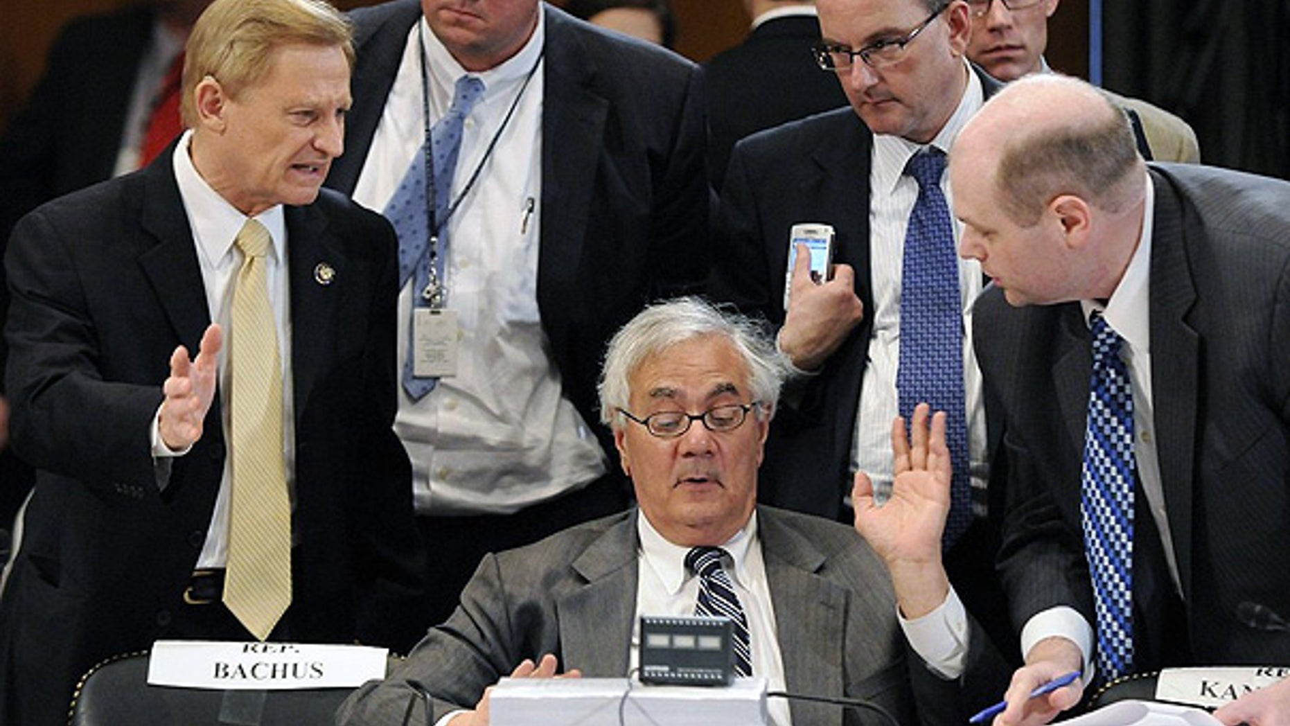 June 24: House Financial Services Committee Chairman Barney Frank talks with a group lawmakers, including Ranking Member Spencer Bachus, left, during a committee conference on Wall Street reform on Capitol Hill.