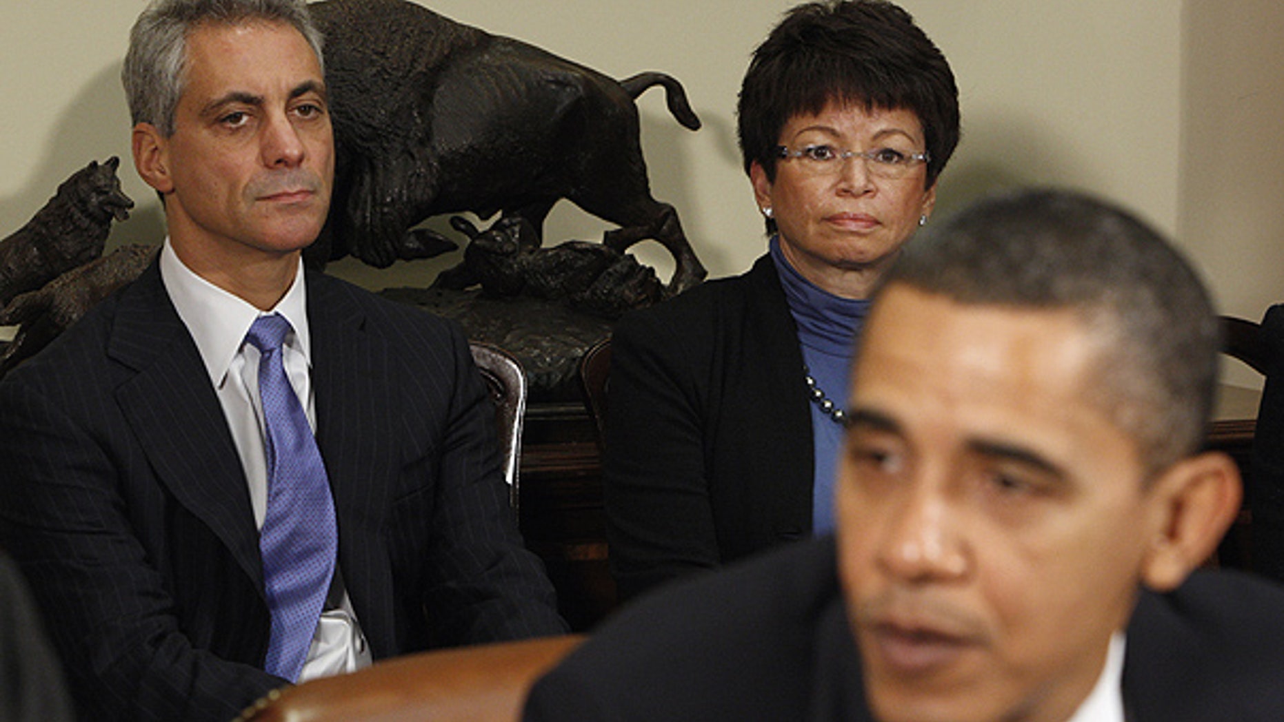 President Obama is joined by Chief of Staff Rahm Emanuel, left, and White House Senior Advisor Valerie Jarrett during a speech at the White House.