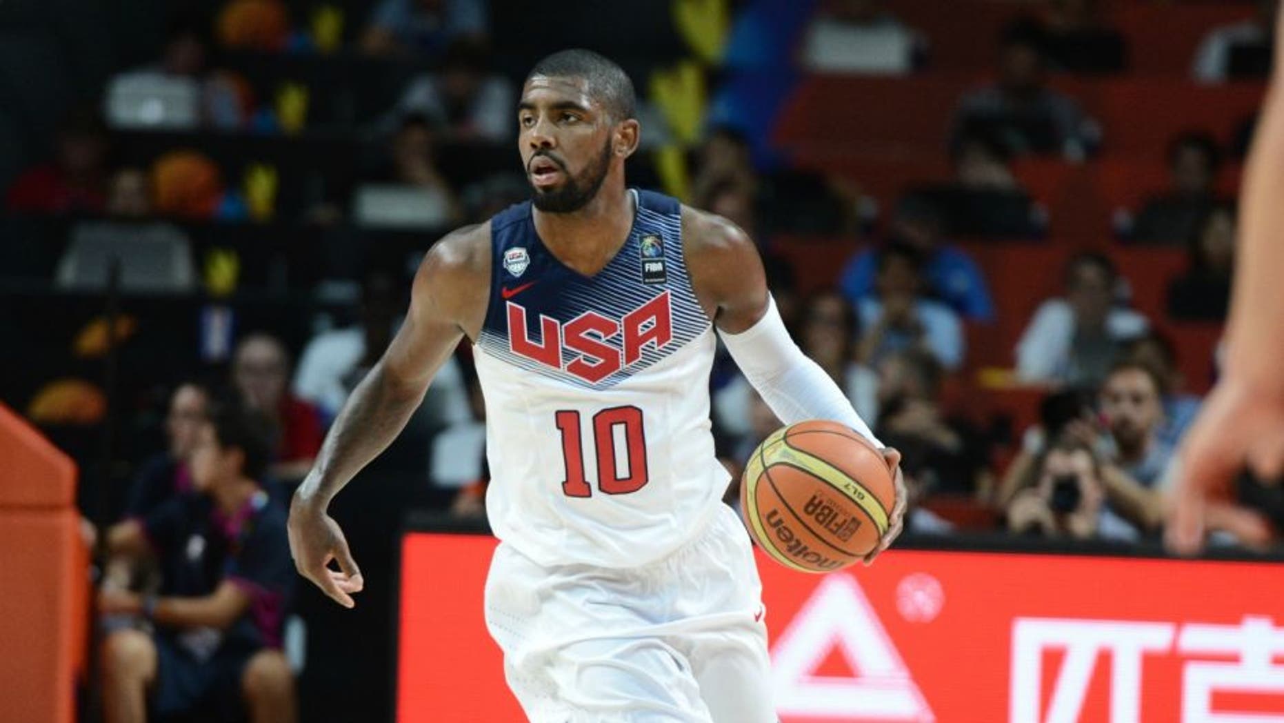 MADRID, SPAIN - SEPTEMBER 14: Kyrie Irving #10 of the USA Men's National Team drives against the Serbia National Team during the 2014 FIBA World Cup Finals at Palacio de Deportes on September 14, 2014 in Madrid, Spain. NOTE TO USER: User expressly acknowledges and agrees that, by downloading and/or using this Photograph, user is consenting to the terms and conditions of the Getty Images License Agreement. Mandatory Copyright Notice: Copyright 2014 NBAE (Photo by Garrett Ellwood/NBAE via Getty Images)