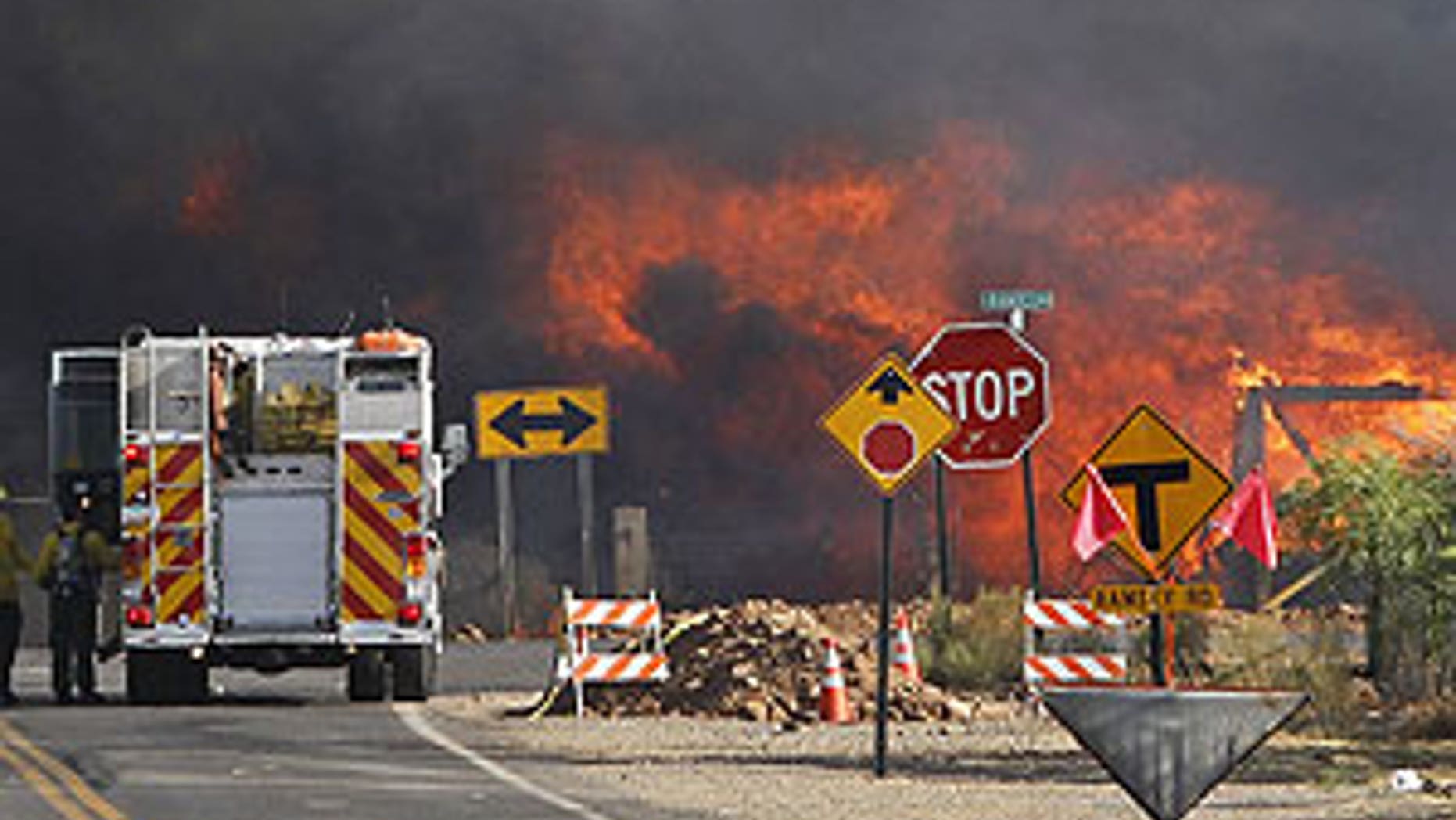 June 19: A home burns at the intersection of Campbello Ave. and Ramsey Rd. from the Monument Fire near Sierra Vista, Ariz.