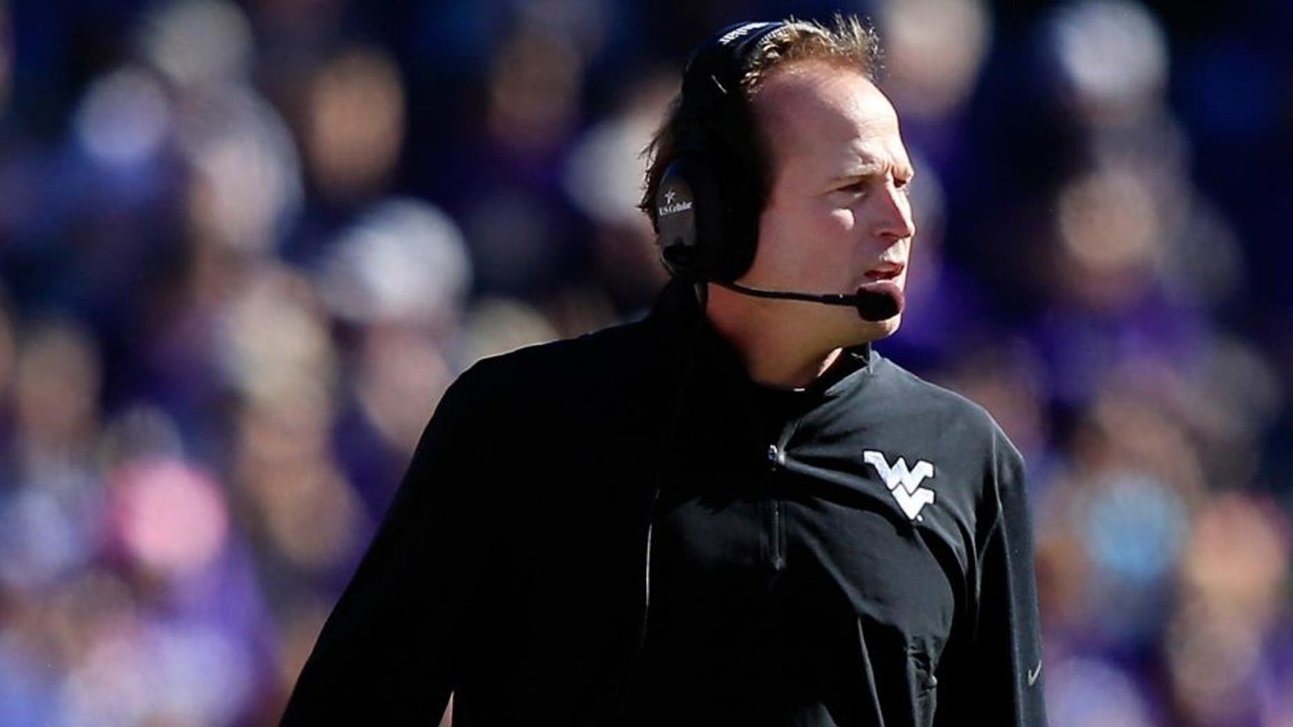 FORT WORTH, TX - NOVEMBER 02: Head coach Dana Holgorsen of the West Virginia Mountaineers watches from the sidelines during the game against the TCU Horned Frogs at Amon G. Carter Stadium on November 2, 2013 in Fort Worth, Texas. (Photo by Jamie Squire/Getty Images)
