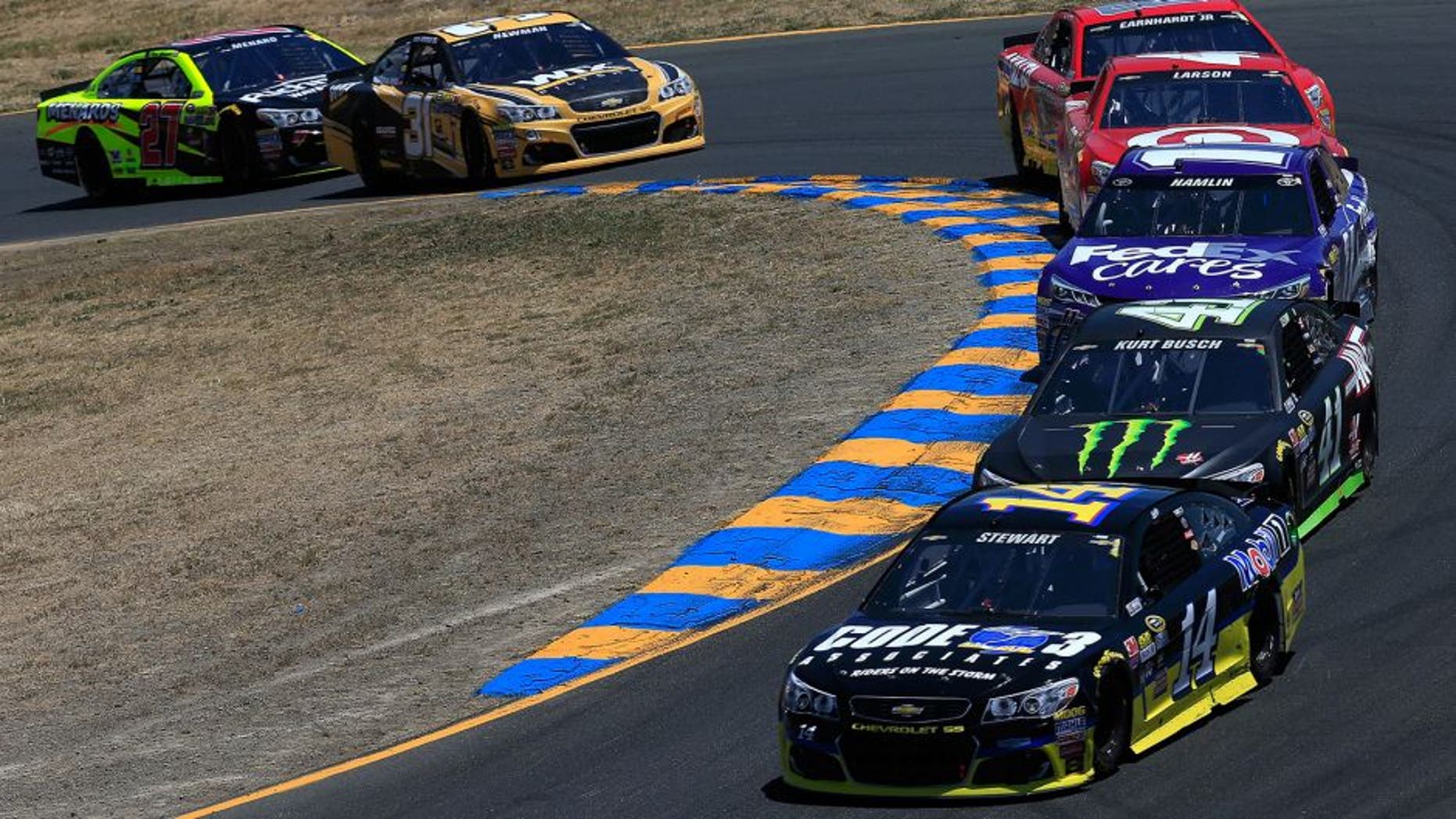 SONOMA, CA - JUNE 26: Tony Stewart, driver of the #14 Code 3 Assoc/Mobil 1 Chevrolet, races Kurt Busch, driver of the #41 Monster Energy/Haas Automation Chevrolet, during the NASCAR Sprint Cup Series Toyota/Save Mart 350 at Sonoma Raceway on June 26, 2016 in Sonoma, California. (Photo by Chris Trotman/NASCAR via Getty Images)