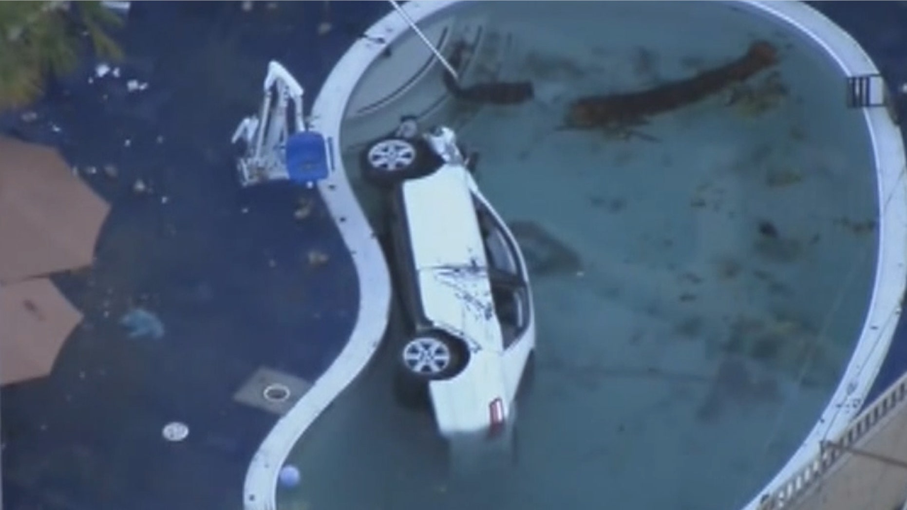 An SUV crashed into a motel pool in the San Pedro community in Los Angeles Sunday night, injuring eight people, including the driver. (KTTV)