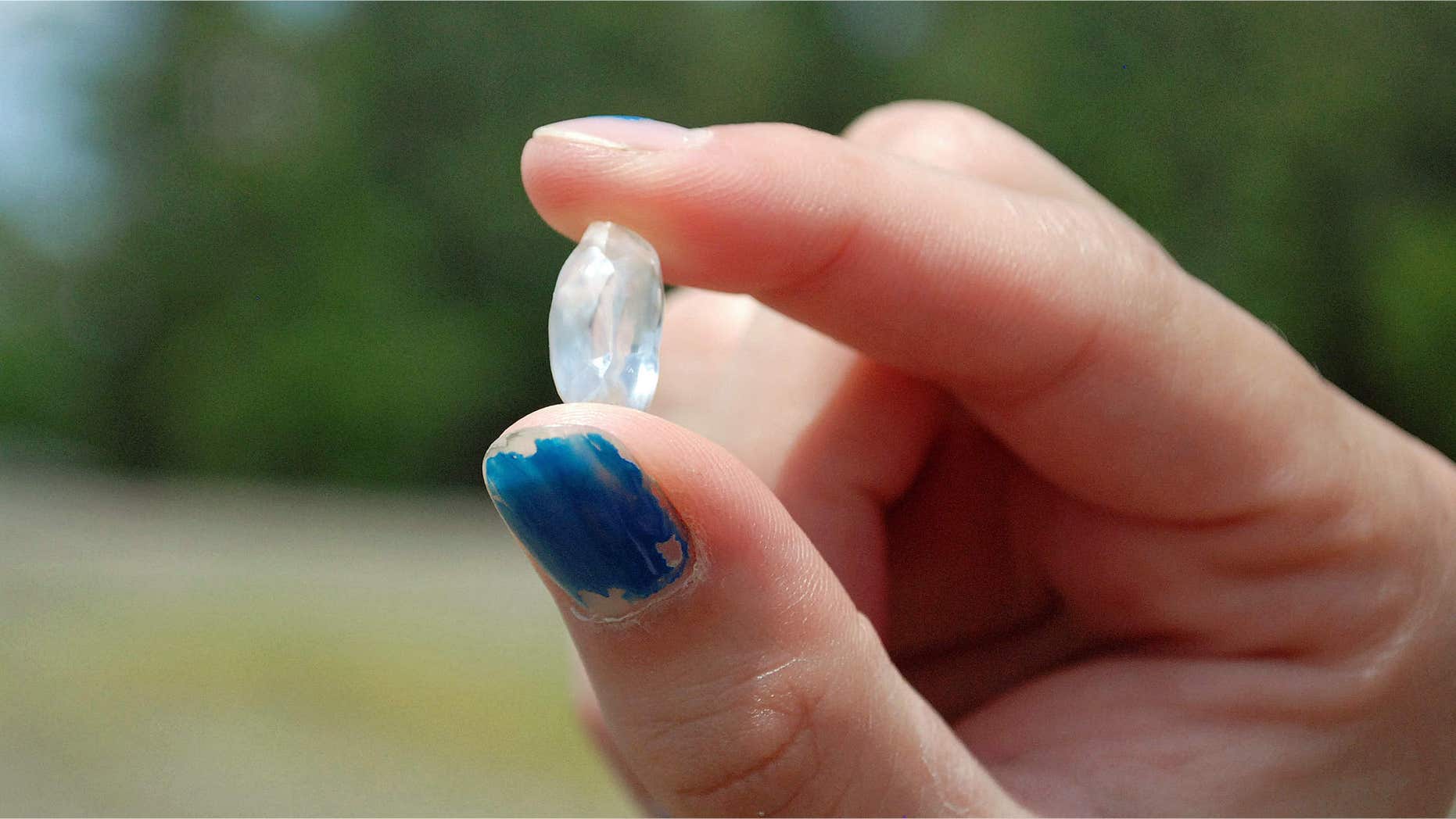 June 24, 2015: This handout photo provided by the Crater of Diamonds State Park Bobbie Oskarson holds the 8.52-carat diamond she found at Arkansas' Crater of Diamonds State Park at Murfreesboro.