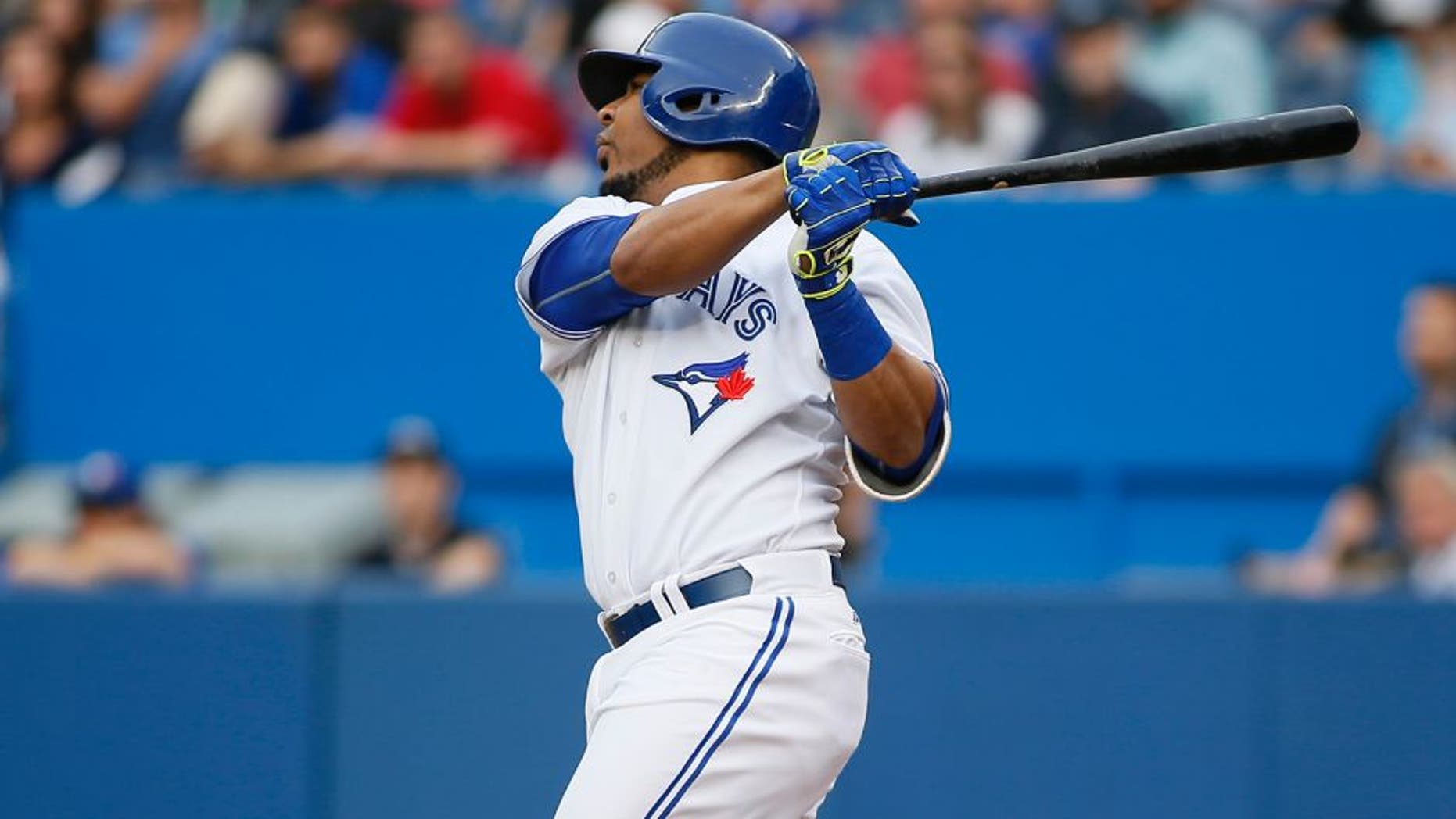 Jun 26, 2015; Toronto, Ontario, CAN; Toronto Blue Jays designated hitter Edwin Encarnacion (10) hits a grand slam homerun in the first inning against the Texas Rangers at Rogers Centre. Mandatory Credit: John E. Sokolowski-USA TODAY Sports