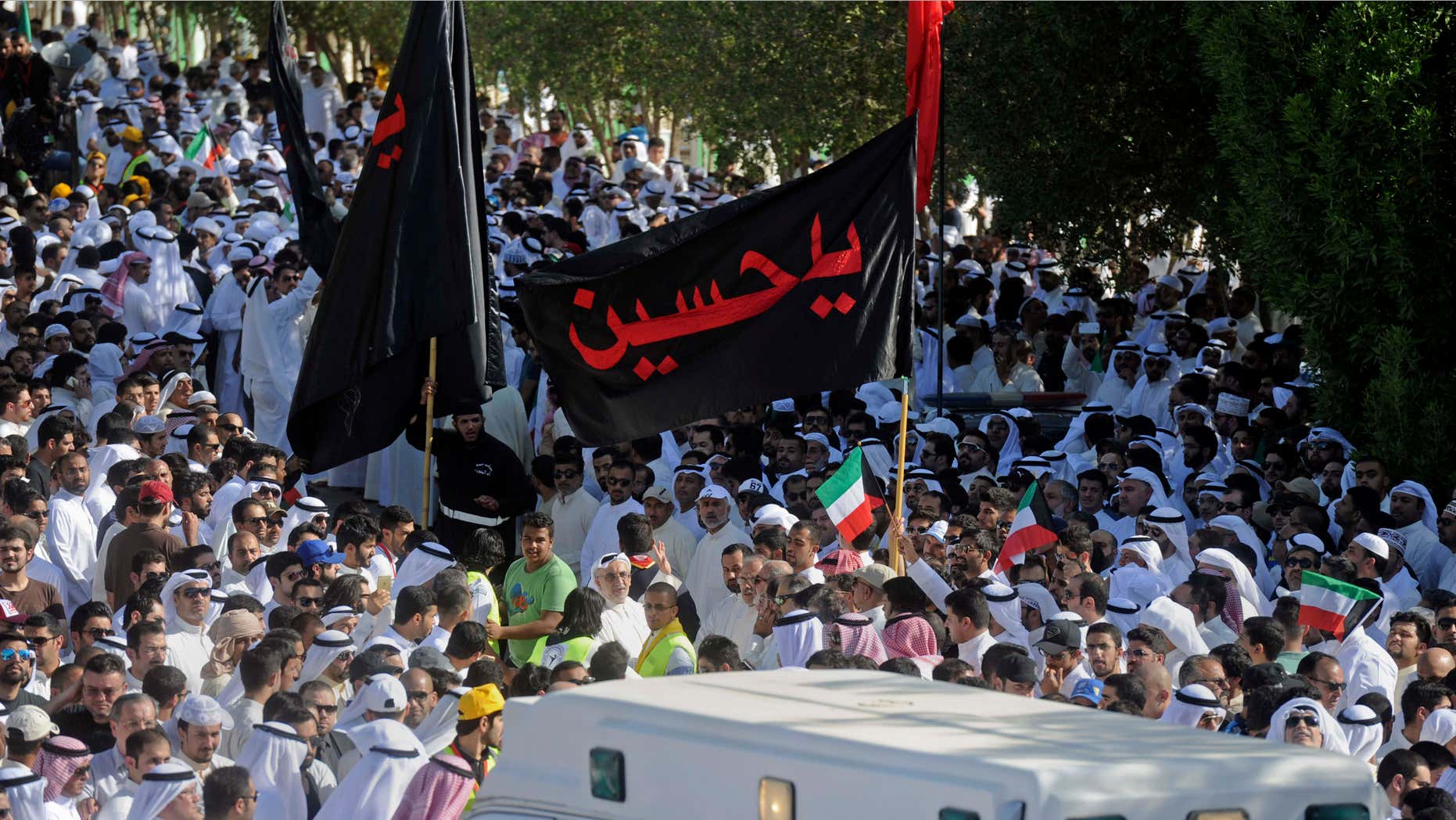 June 27, 2015: Thousands of Sunnis and Shiites from across the country take part in a mass funeral procession for 27 people killed in a suicide bombing that targeted the Shiite Imam Sadiq Mosque a day earlier, at the Grand Mosque in Kuwait City, Kuwait.
