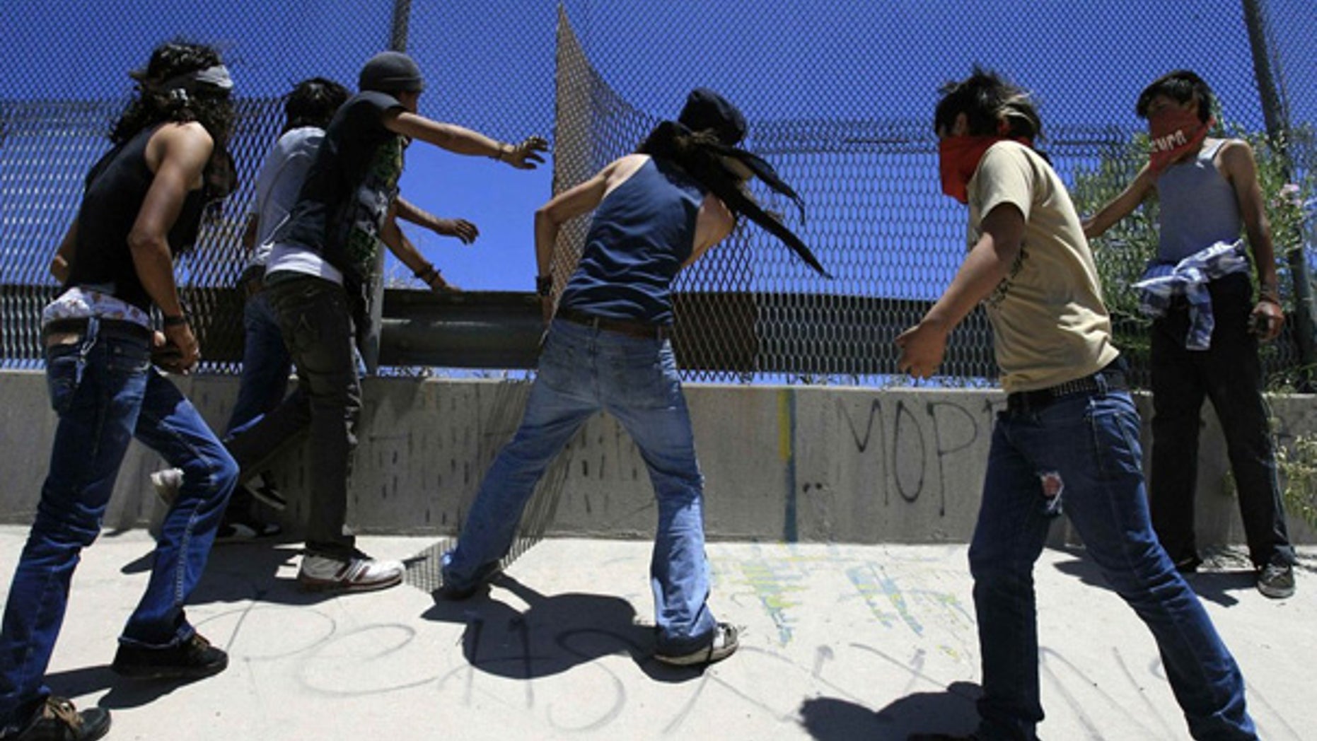 June 12: Mexicans are seen damaging the U.S. border fence, during a protest on the outskirts of Ciudad Juarez.