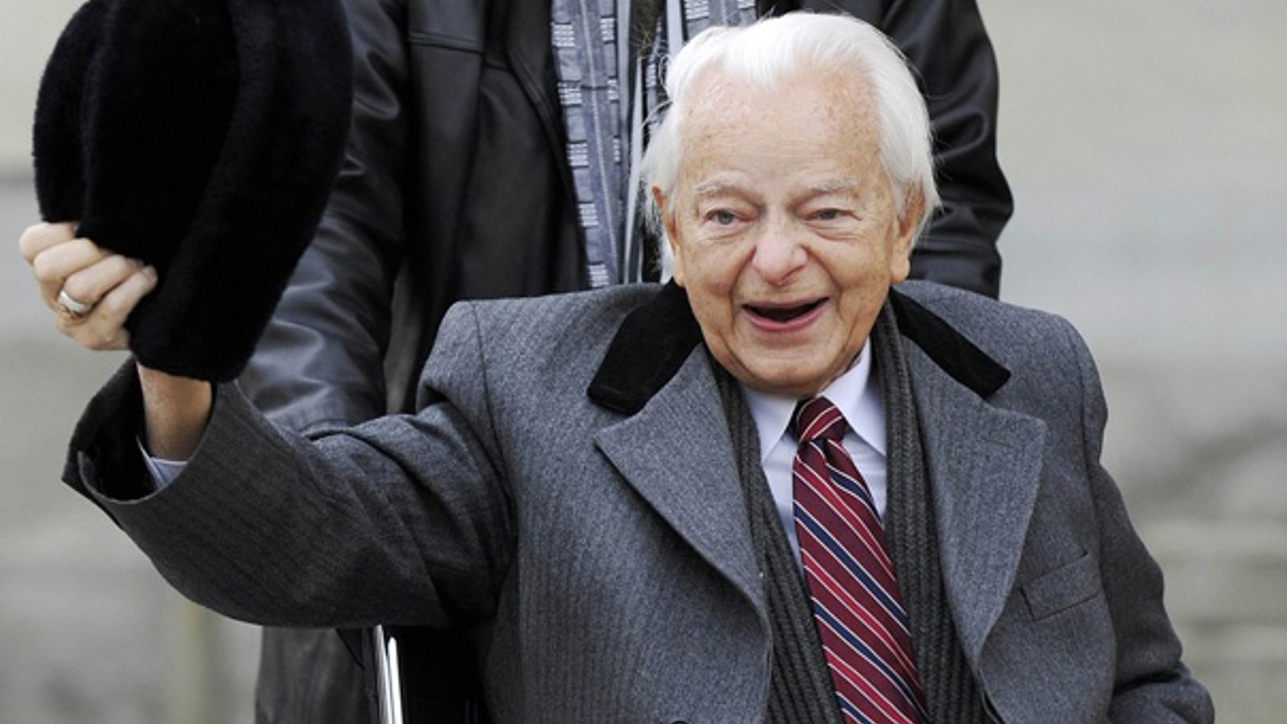 Feb. 2009: Sen. Robert Byrd doffs his hat for reporters as he arrives at the Capitol in Washington.
