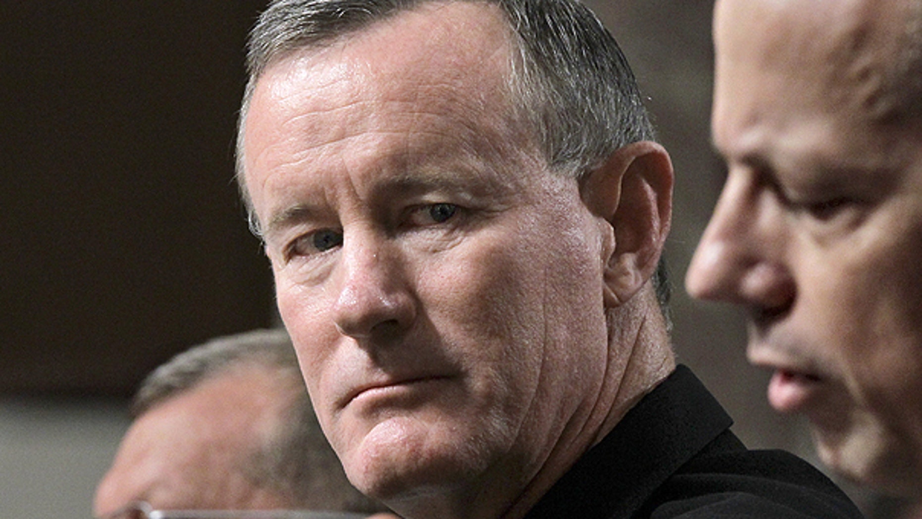 June 28: Navy Vice Adm. William H. McRaven, center, nominee to become commander of the U.S. Special Operations Command, listens to testimony by Marine Lt. Gen. John Allen, right, nominee to become commander of U.S. forces in Afghanistan, during a confirmation hearing on Capitol Hill in Washington.