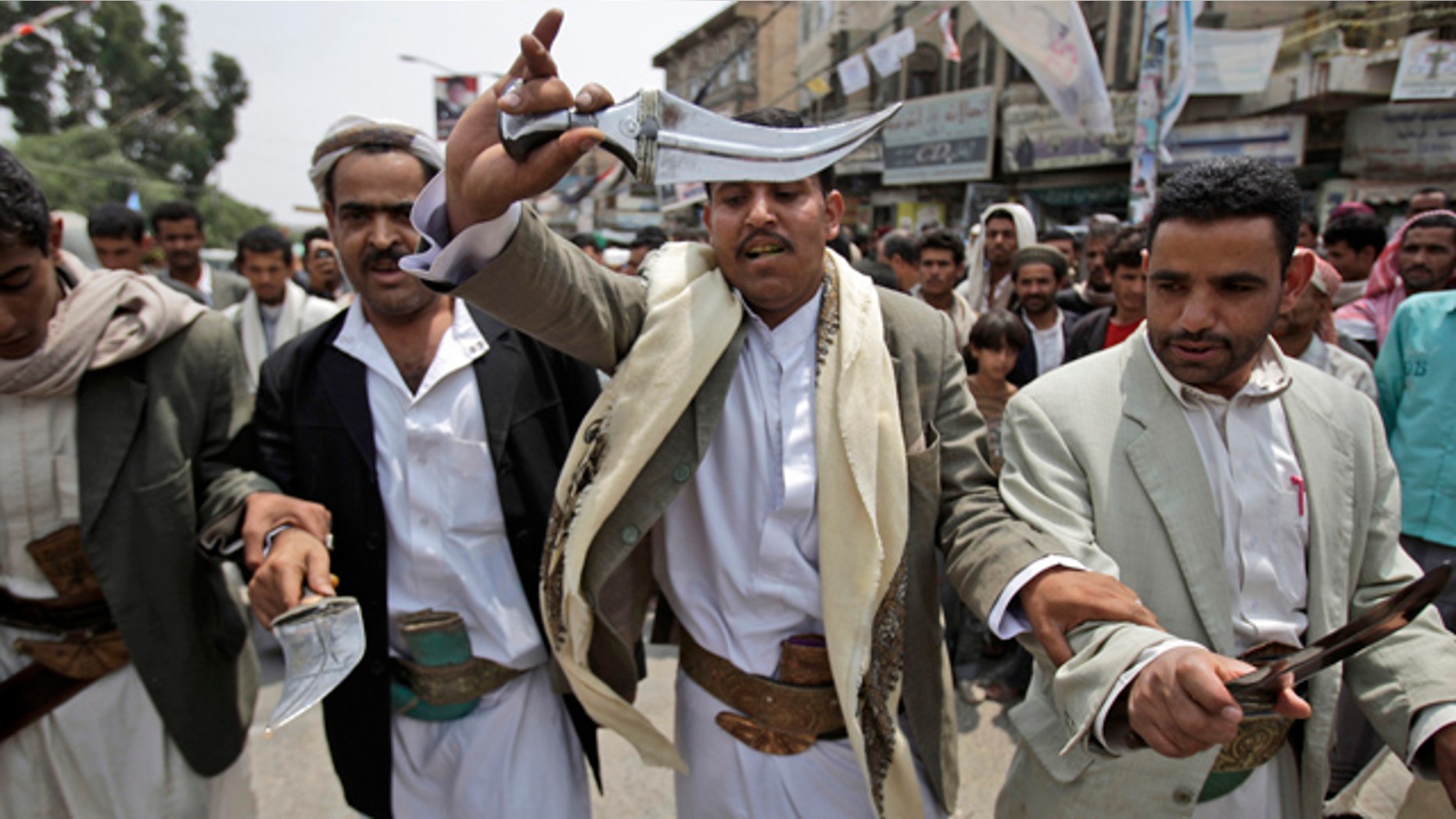 June 28: Anti-government protestors dance holding their daggers during a demonstration demanding the resignation of Yemeni President Ali Abduallah Saleh, in Sanaa, Yemen.