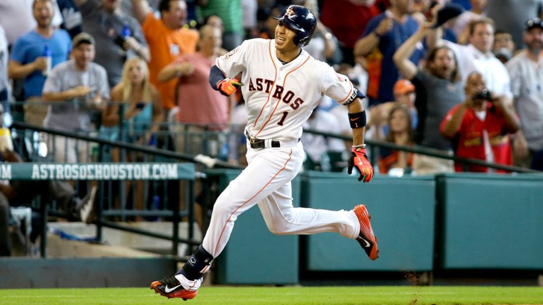 Jun 28, 2015; Houston, TX, USA; Houston Astros shortstop Carlos Correa (1) rounds third base to score a run during the fourth inning against the New York Yankees at Minute Maid Park. Mandatory Credit: Troy Taormina-USA TODAY Sports