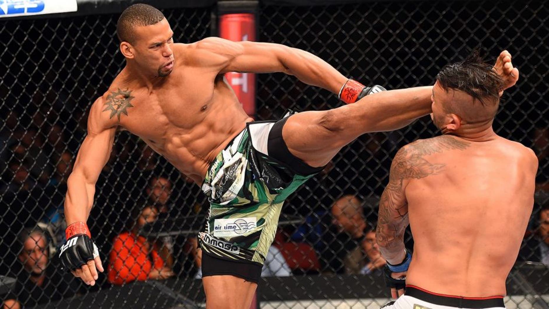HOLLYWOOD, FL - JUNE 27: (L-R) Thiago Santos of Brazil lands a kick to the head of Steve Bosse of Canada in their middleweight during the UFC Fight Night event at the Hard Rock Live on June 27, 2015 in Hollywood, Florida. (Photo by Josh Hedges/Zuffa LLC/Zuffa LLC via Getty Images)
