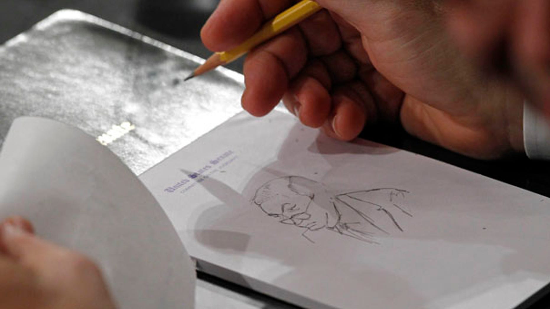 June 29: Sen. Al Franken sketches Sen. Jeff Sessions, R-Ala., during the Judiciary Committee's confirmation hearings for Supreme Court nominee Elena Kagan.