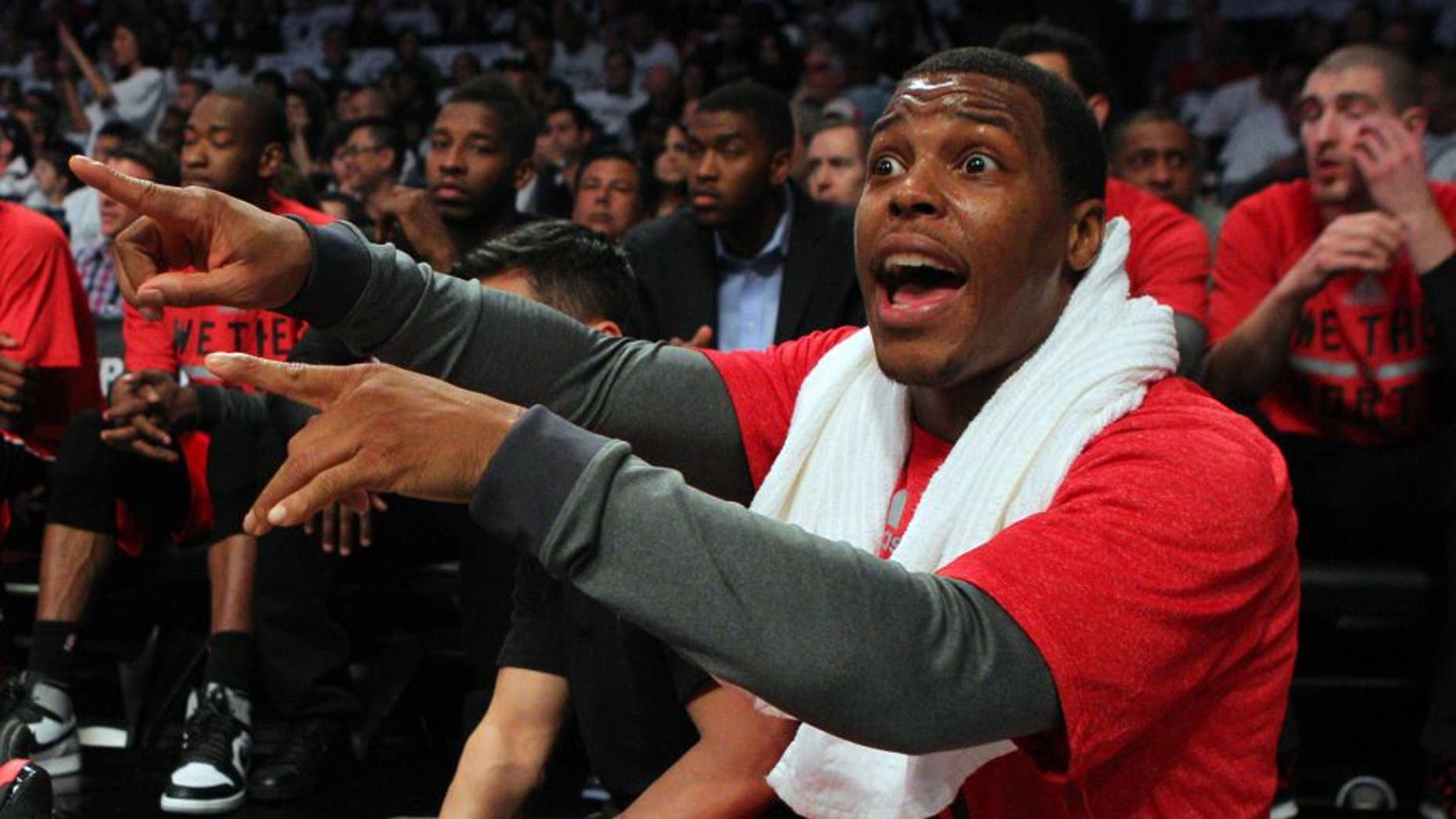 May 2, 2014; Brooklyn, NY, USA; Toronto Raptors point guard Kyle Lowry (7) calls out to a teammate from the bench during the second quarter of game six of the first round of the 2014 NBA Playoffs against the Brooklyn Nets at Barclays Center. Mandatory Credit: Brad Penner-USA TODAY Sports