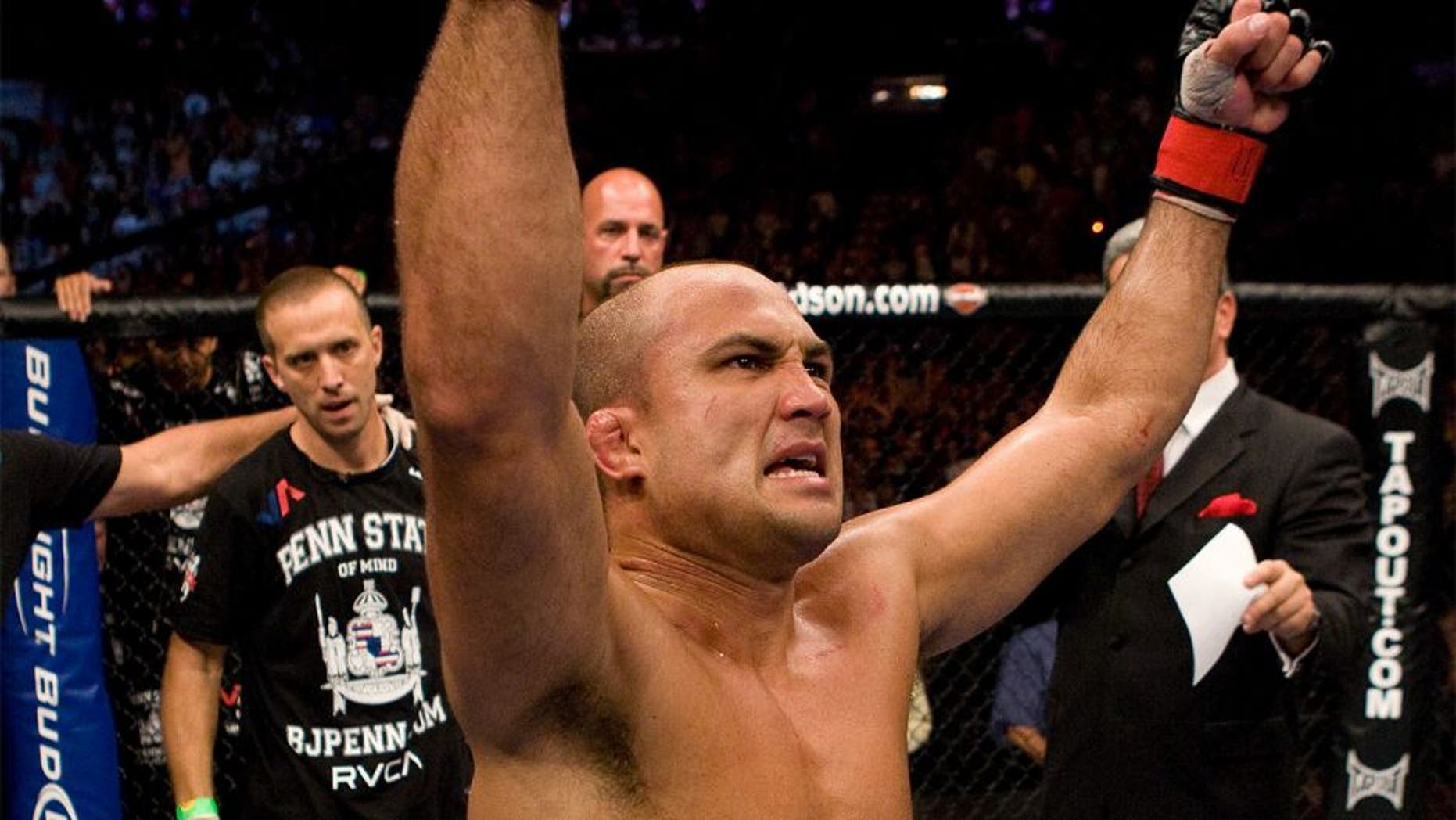 PHILADELPHIA - AUGUST 8: BJ Penn (white shorts) def. Kenny Florian (black shorts) - Submission (rear naked choke) - 3:54 round 4 during UFC 101 at Wachovia Center on August 8, 2009 in Philadelphia, Pennsylvania. (Photo by Josh Hedges/Zuffa LLC via Getty Images)