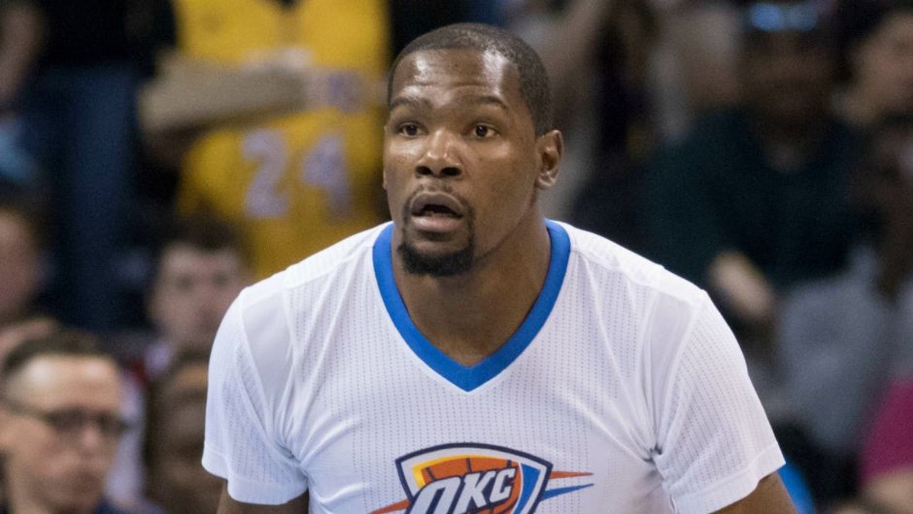 OKLAHOMA CITY, OK - APRIL 11: Kevin Durant #35 of the Oklahoma City Thunder brings the ball down court against the Los Angeles Lakers during a NBA game at the Chesapeake Energy Arena on April 11, 2016 in Oklahoma City, Oklahoma. NOTE TO USER: User expressly acknowledges and agrees that, by downloading and or using this photograph, User is consenting to the terms and conditions of the Getty Images License Agreement. (Photo by J Pat Carter/Getty Images)