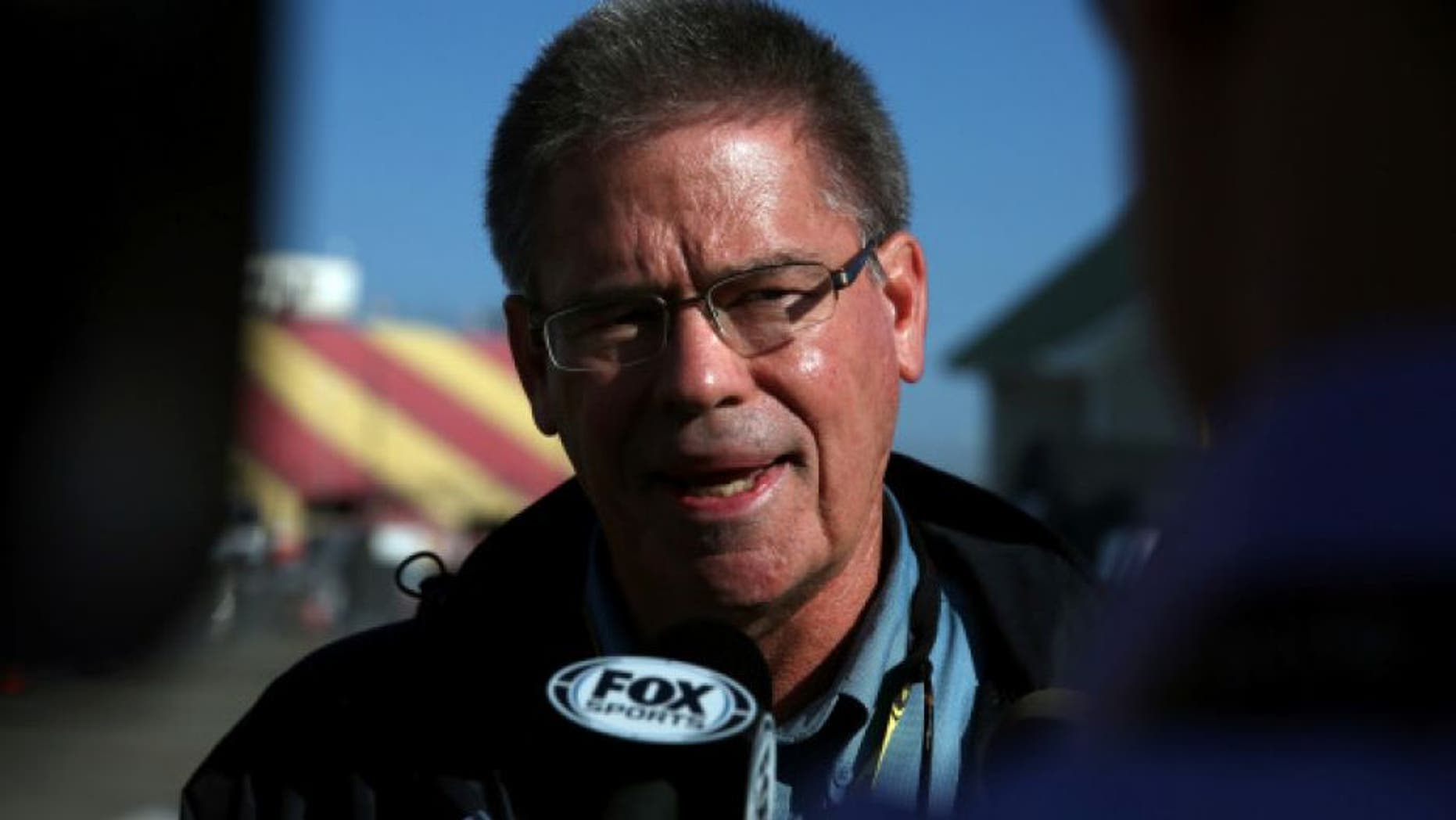WATKINS GLEN, NY - AUGUST 10: Kerry Tharp, NASCAR senior director of communications for competition speaks to the media about Tony Stewart in the garage area prior to the NASCAR Sprint Cup Series Cheez-It 355 at Watkins Glen International on August 10, 2014 in Watkins Glen, New York. (Photo by Mark Wilson/Getty Images)