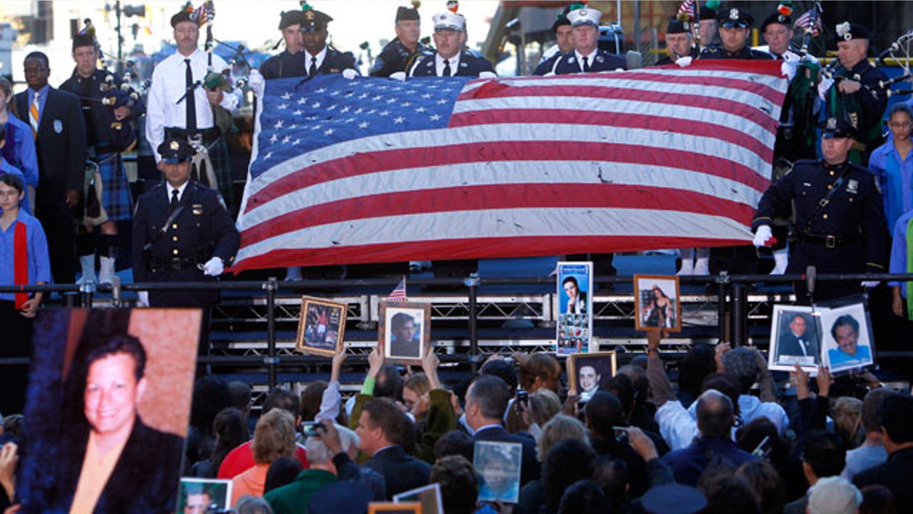 The World Trade Center flag is presented as friends and relatives of the victims of the Sept. 11, 2001 attacks gather for a commemoration ceremony at Zuccotti Park, adjacent to ground zero, on the ninth anniversary of the terrorist attacks on the World Trade Center, Saturday, Sept. 11, 2010 in New York.