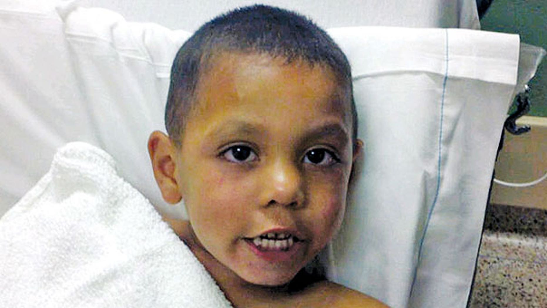 This undated photo provided by the Sweetwater (Texas) Police Department shows 4-year-old Angel Flores. Flores was found standing in the middle of Interstate 20 near Sweetwater early Tuesday, June 28, 2011. The boy's father, Carlos Rico, is in jail in Saginaw after being charged with endangering a child for reportedly abandoning the boy on the interstate.
