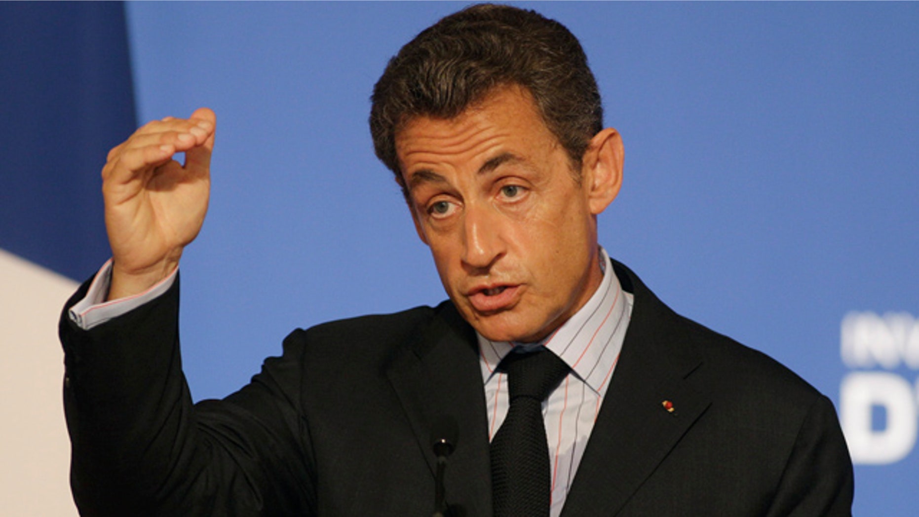 June 27: France's President Nicolas Sarkozy gestures as he speaks during a press conference at the Elysee Palace.