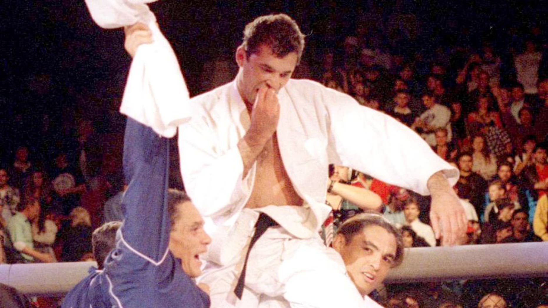 DENVER, CO - NOVEMBER 12: Royce Gracie (USA), 4th-degree Jiu-Jitsu Black Belt, is lifted by members of his corner after beating Gerard Gordeau (NET) to win the Ultimate Fighting Championships UFC 1 on November 12, 1993 at the McNichols Sports Arena in Denver, Colorado. (Photo by Holly Stein/Getty Images)