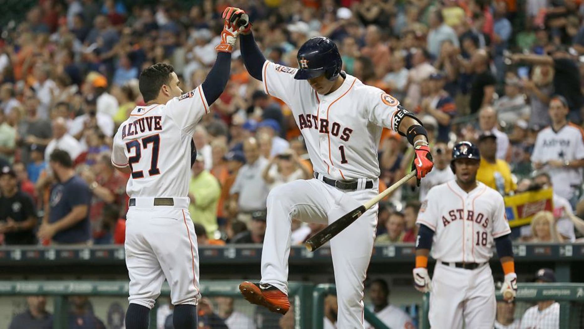Jun 29, 2015; Houston, TX, USA; Houston Astros shortstop Carlos Correa (1) celebrates with second baseman Jose Altuve (27) after a home-run against the Kansas City Royals in the third inning at Minute Maid Park. Mandatory Credit: Thomas B. Shea-USA TODAY Sports