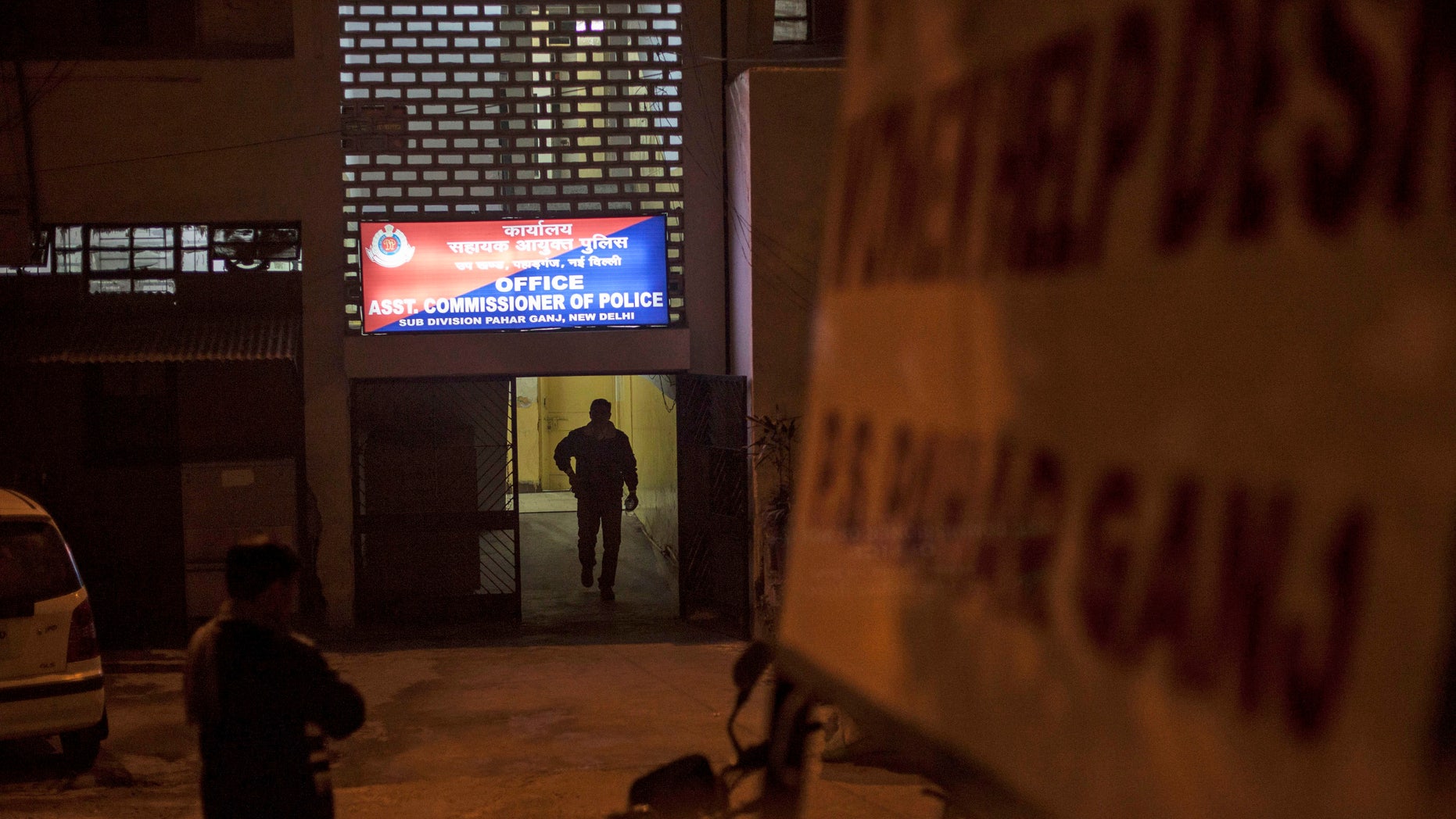 Jan. 15, 2014: An Indian policemen walks out of the police station which is investigating the gang-rape of a Danish tourist in New Delhi, India.