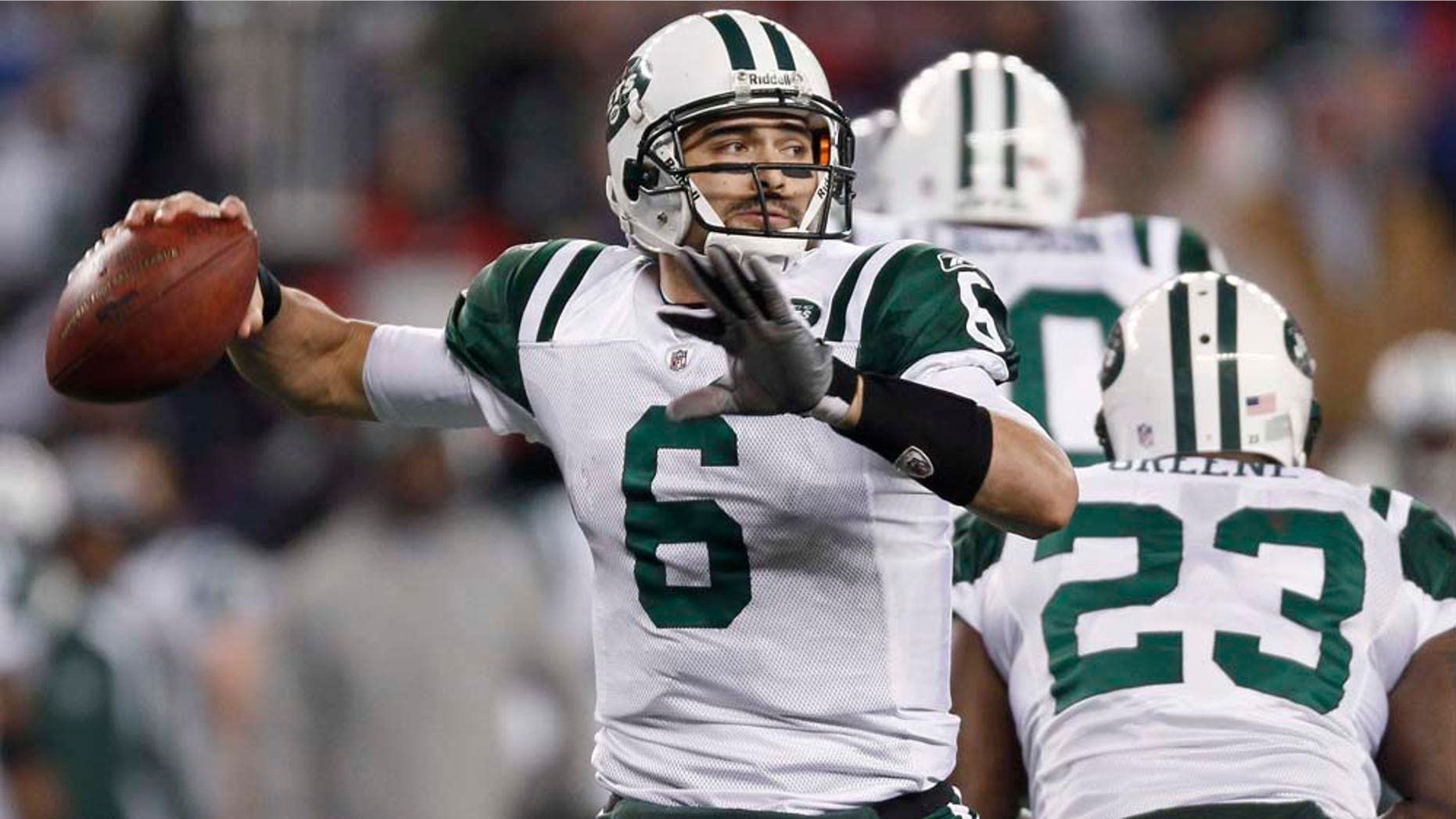New York Jets quarterback Mark Sánchez prepares to pass against the New England Patriots during the second half of an NFL divisional football playoff game in Foxborough, Mass., Sunday, Jan. 16, 2011. (AP Photo/Winslow Townson)