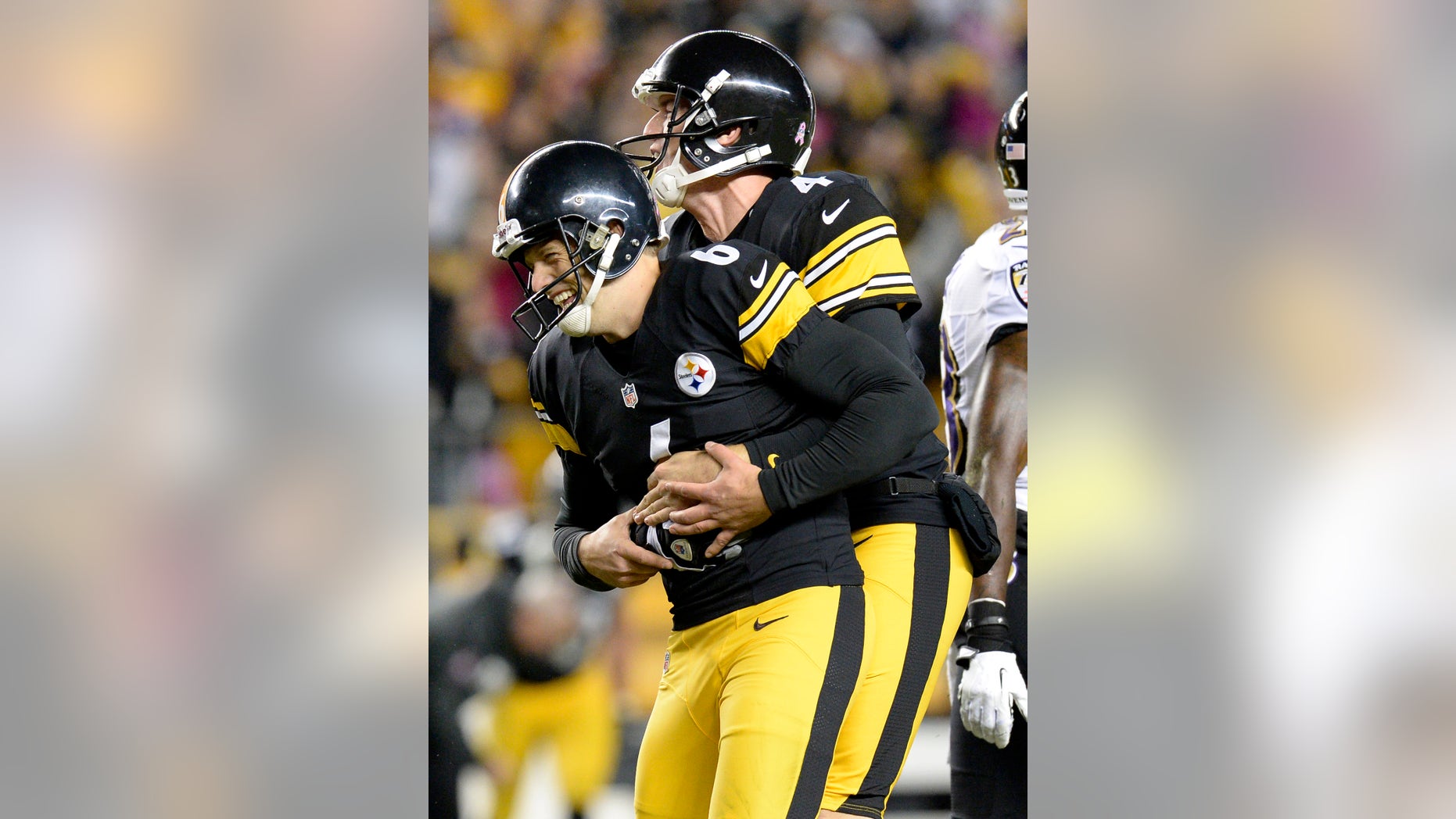 Pittsburgh Steelers holder Zoltan Mesko, right, celebrates with kicker Shaun Suisham after Suisham kicks the winning field goal against the Baltimore Ravens in the fourth quarter of an NFL football game on Sunday, Oct. 20, 2013, in Pittsburgh. The Steelers won 19-16. (AP Photo/Don Wright)