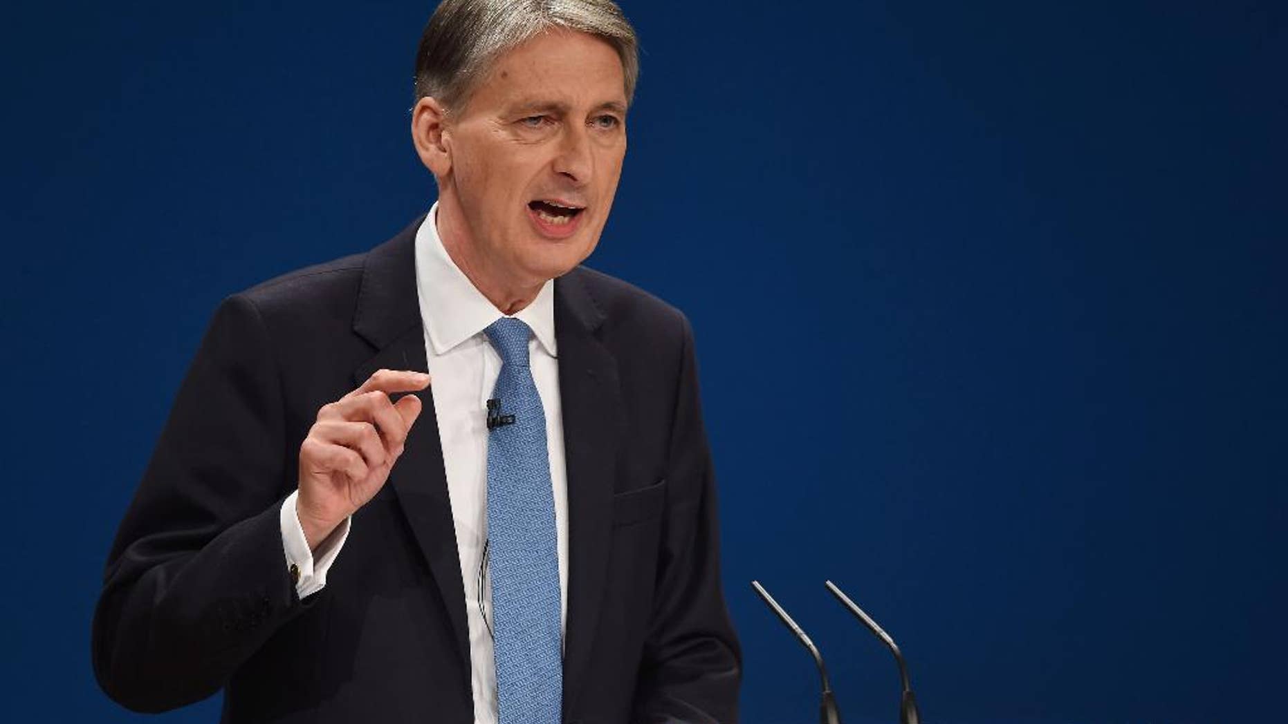 Britain's Chancellor of the Exchequer Philip Hammond speaks on the second day of the Conservative party conference in Birmingham, England, Monday Oct. 3, 2016. Philip Hammond told the BBC on Monday that Britain will face a couple of years, or longer, of uncertainty as Britain goes through the process of leaving the 28-nation trading bloc. (Joe Giddens/PA via AP)