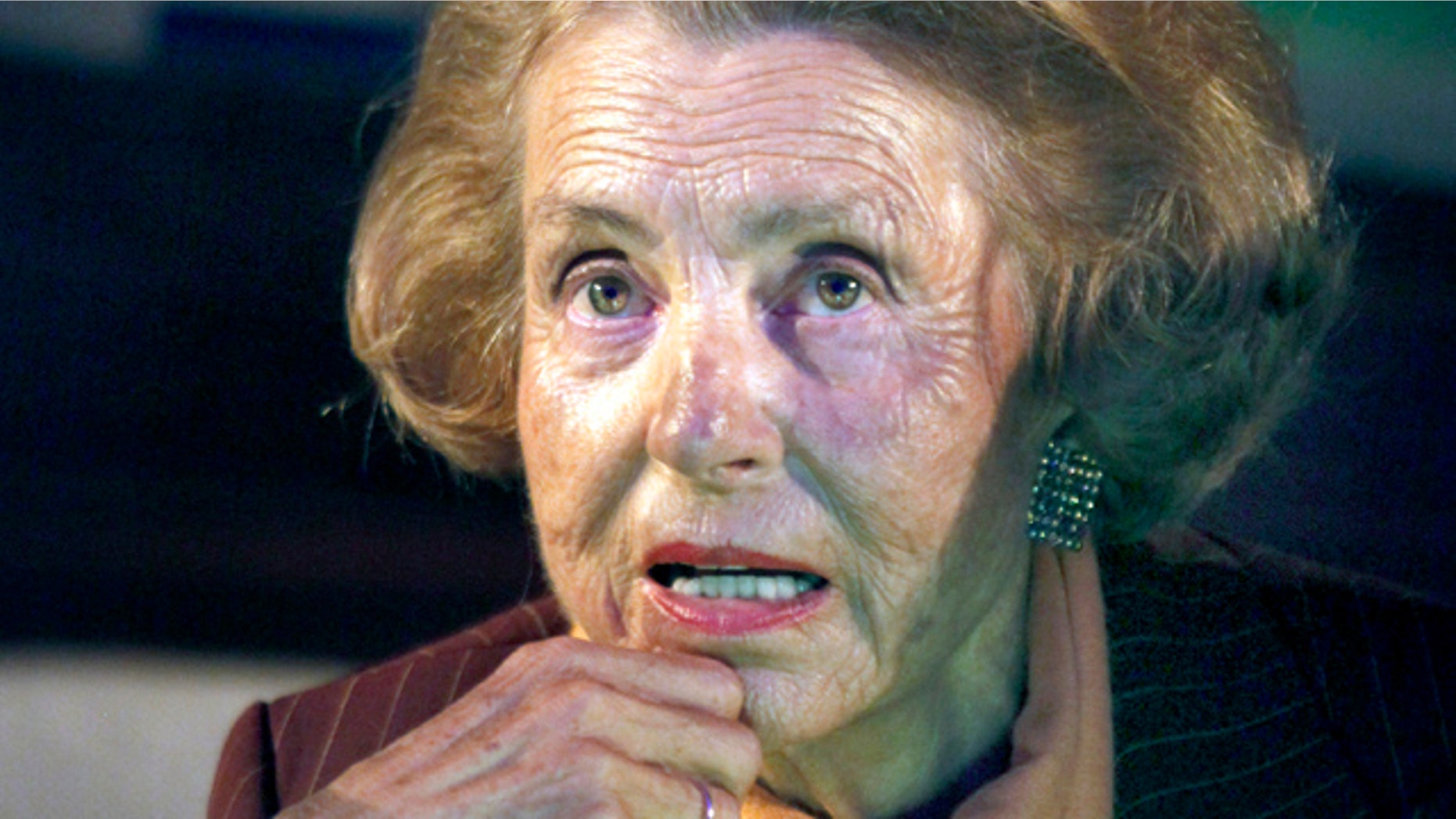 FILE - This March 4, 2010 photo shows Liliane Bettencourt, during a press conference at the UNESCO headquarters in Paris. An inheritance dispute over the fortune of France's richest woman is ensnaring an influential government minister who also runs the cash box of French President Nicolas Sarkozy's political party. A suspected con job, alleged tax evasion and leaked phone recordings are all feeding the growing drama around Liliane Bettencourt, the heiress of cosmetics giant L'Oreal. (AP Photo/Thibault Camus)