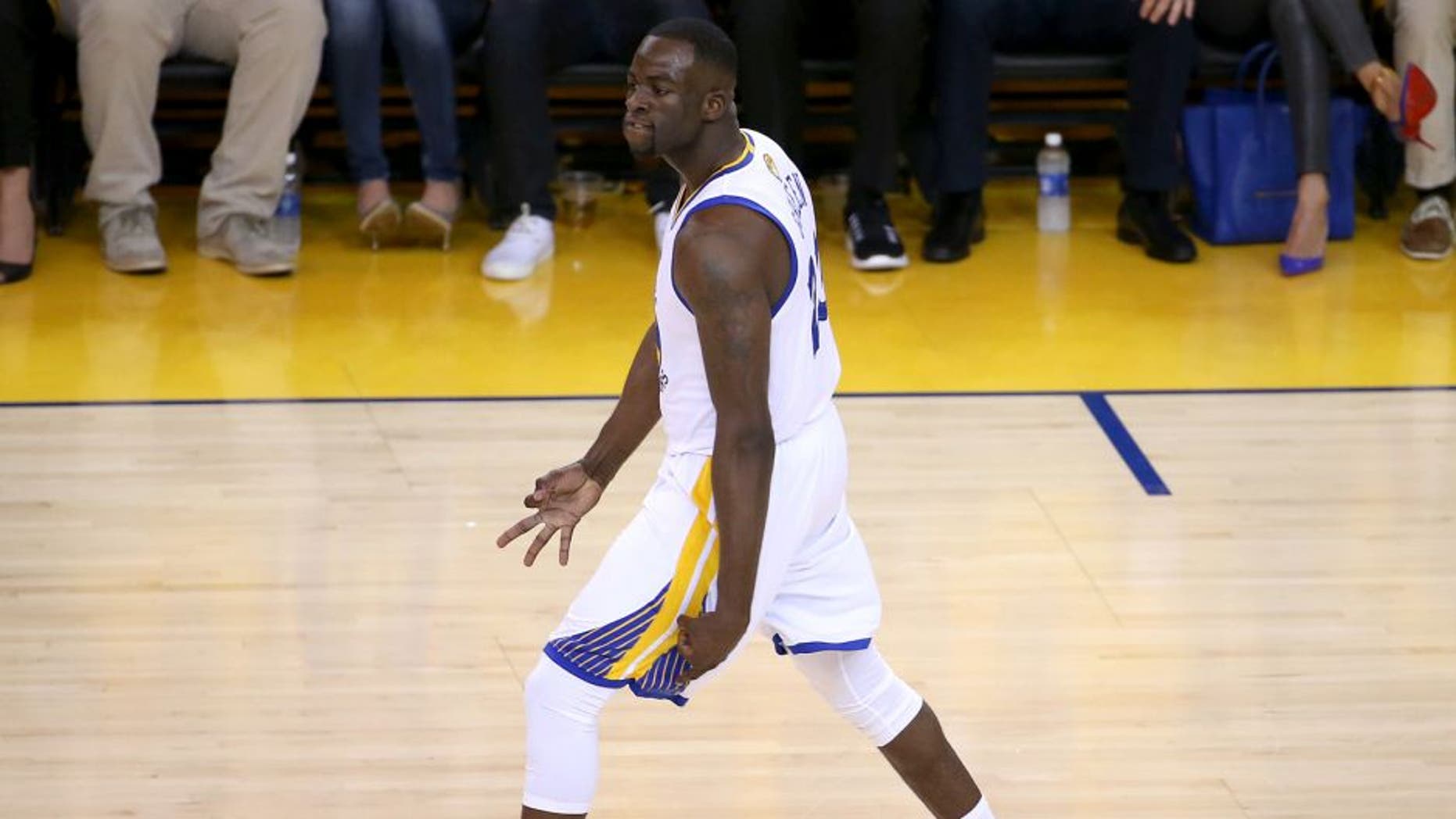 Jun 14, 2015; Oakland, CA, USA; Golden State Warriors forward Draymond Green (23) reacts after a three pointer during the first quarter against the Cleveland Cavaliers in game five of the NBA Finals at Oracle Arena. Mandatory Credit: Kelley L Cox-USA TODAY Sports