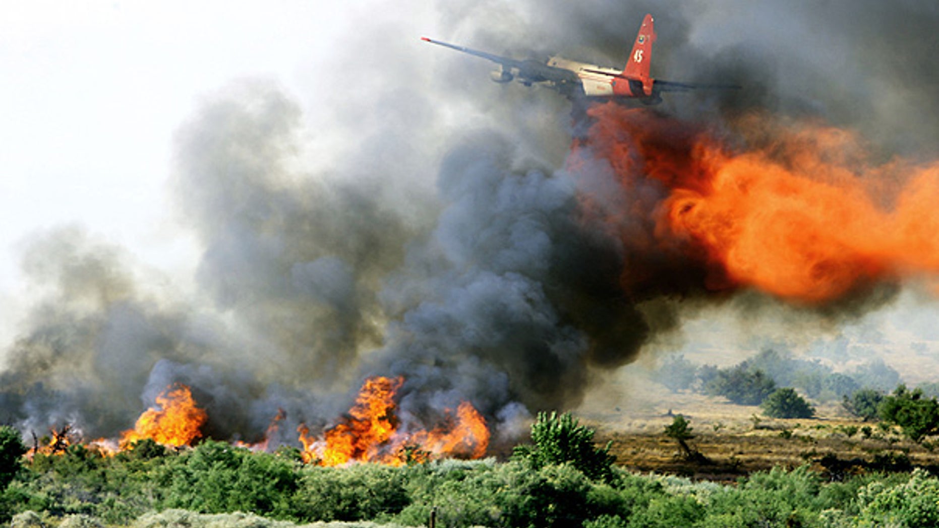 July 1: A tanker drops fire retardant over a fire near Moapa National Wildlife Refuge, 55 miles northeast of Las Vegas.