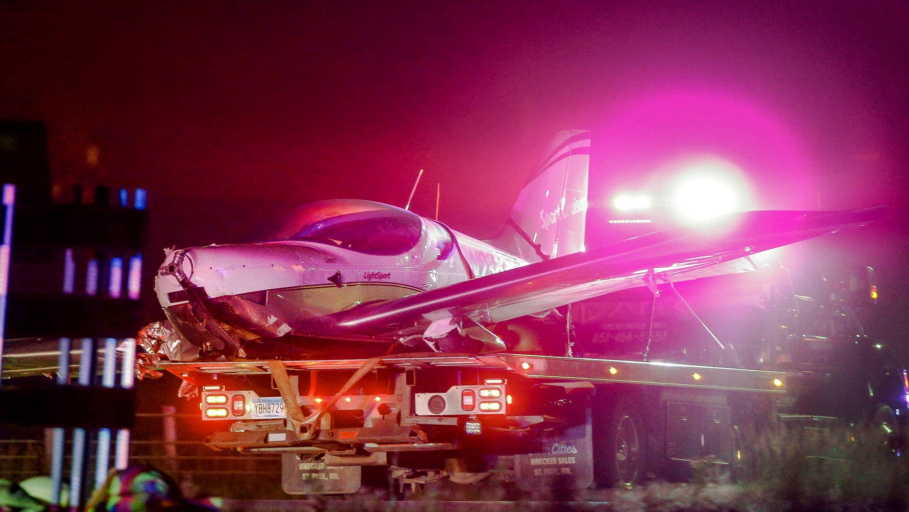 A single-engine SportCruiser plane is towed on Interstate 35, Friday, July 1, 2016 in Wyoming, Minn.