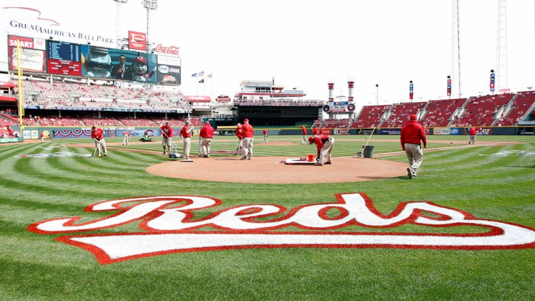 Mar 31, 2014; Cincinnati, OH, USA; A general view of the Cincinnati Reds grounds keepers preparing the field prior to the game against the St. Louis Cardinals at Great American Ball Park. Mandatory Credit: Frank Victores-USA TODAY Sports