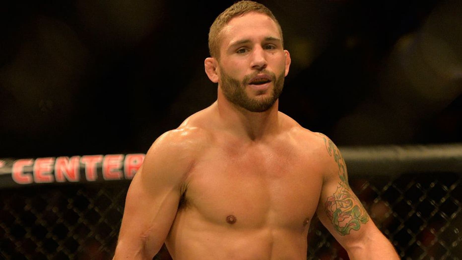 Apr 4, 2015; Fairfax, VA, USA; Chad Mendes (red gloves) celebrates after the first round of technical knock out against Richardo Lamas (not pictured) during UFC Fight Night at Patriot Center. Mandatory Credit: Tommy Gilligan-USA TODAY Sports
