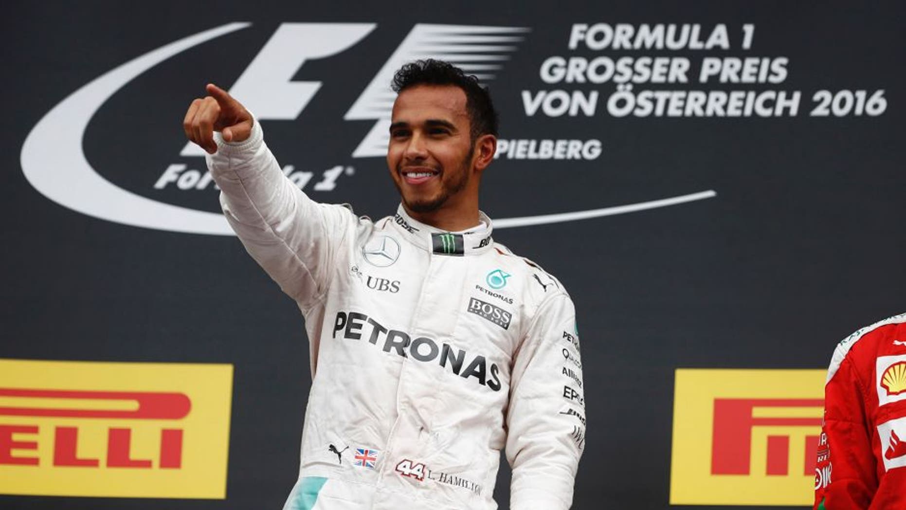 Red Bull Ring, Spielberg, Austria. Sunday 03 July 2016. Lewis Hamilton, Mercedes F1 W07 Hybrid celebrates from the podium after winning the race. World Copyright: Glenn Dunbar/LAT Photographic ref: Digital Image _V2I4263