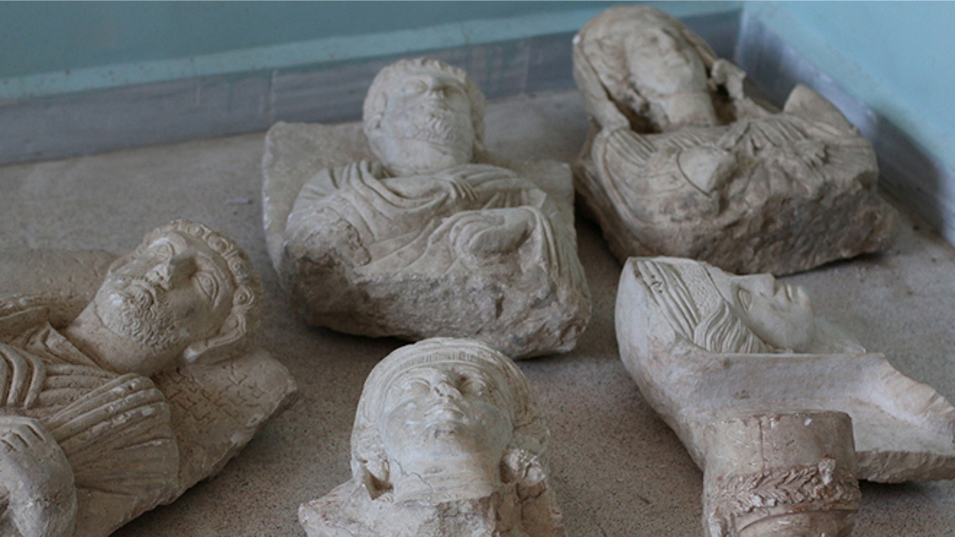July 3, 2015: This image posted on a militant website by the Aleppo branch of the Islamic State group on which has been verified and is consistent with other AP reporting, shows items that the group claims are six smuggled archaeological pieces from the historic central town of Palmyra.