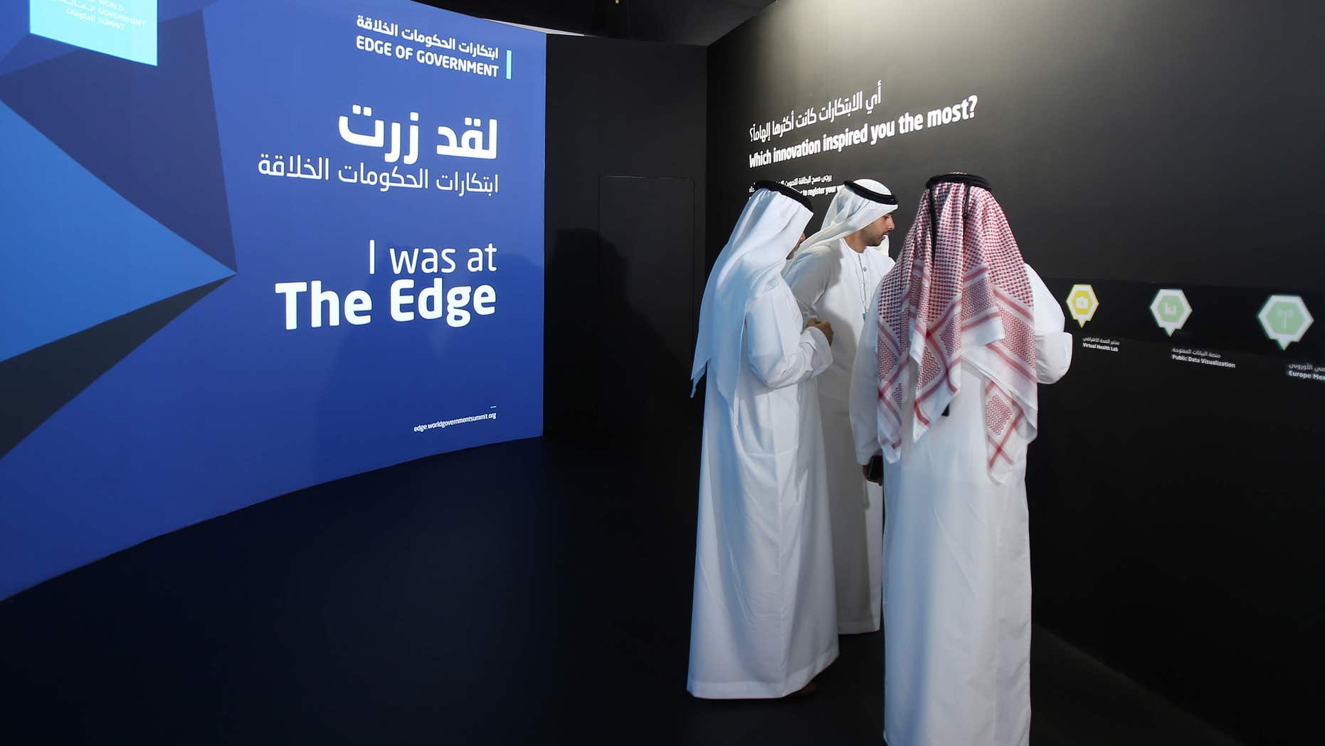 FILE -- In this Feb. 8, 2016 file photo, Emirati officials visit an exhibition at the World Government Summit in Dubai, United Arab Emirates.