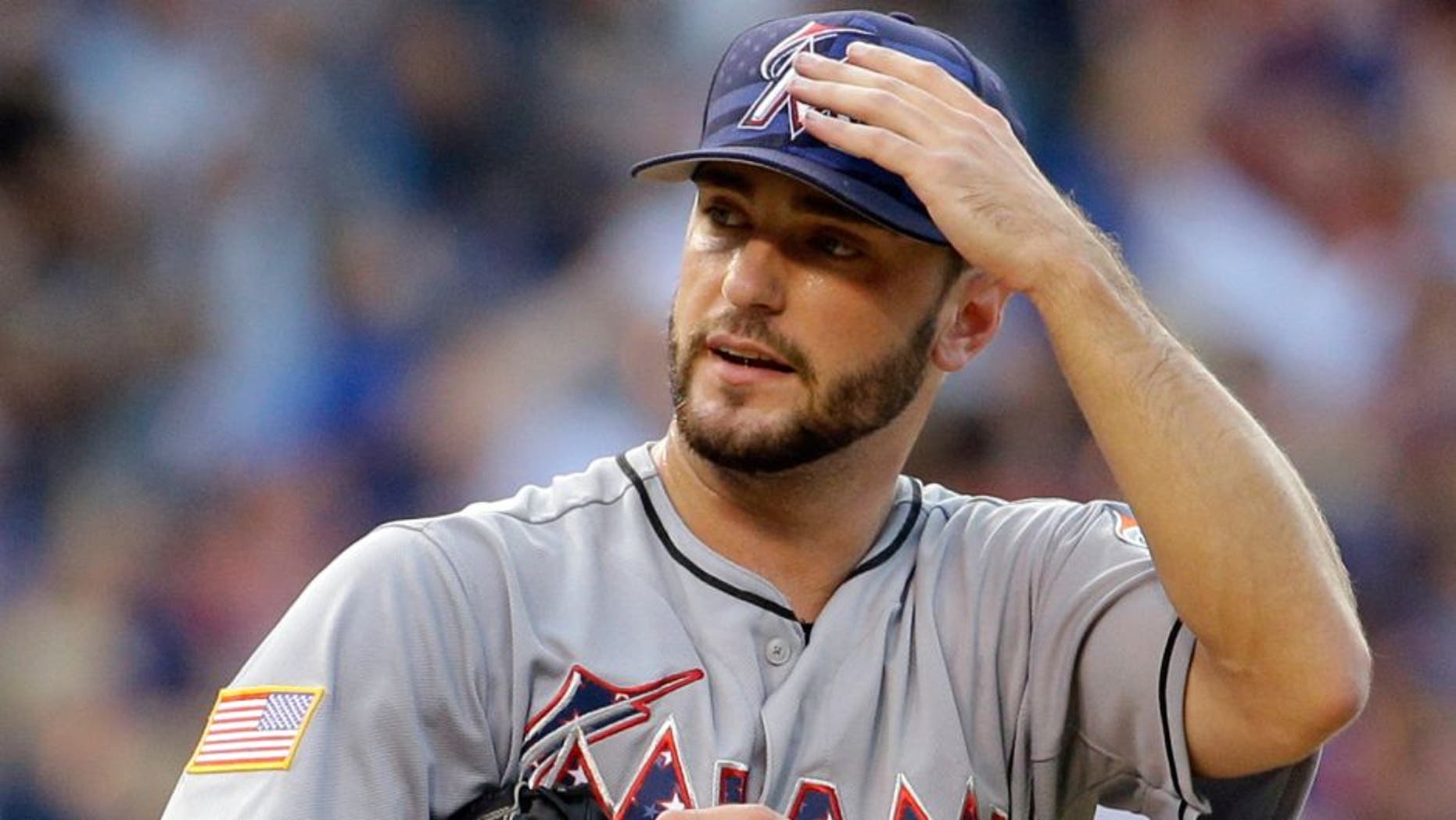 Miami Marlins starter Jarred Cosart reacts after Chicago Cubs' Kris Bryant hit a grand slam during the second inning of a baseball game Saturday, July 4, 2015, in Chicago. (AP Photo/Nam Y. Huh)