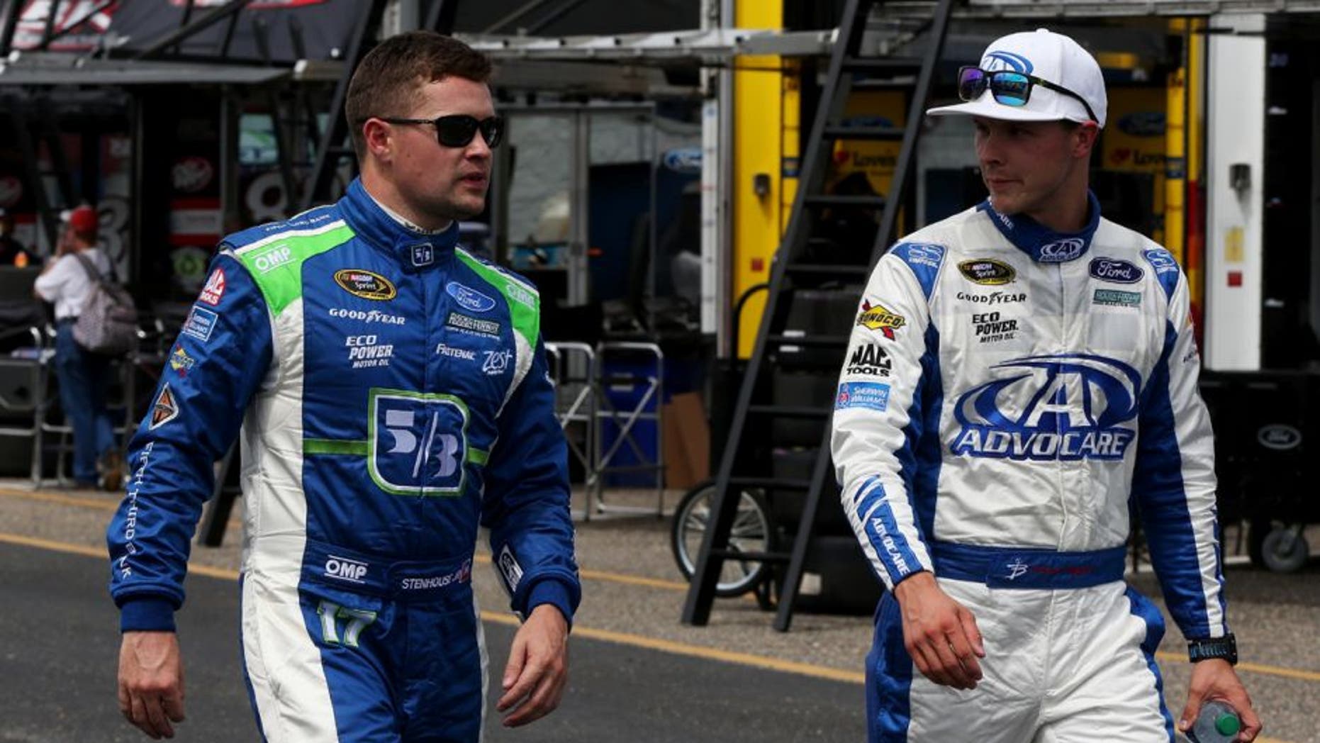 TALLADEGA, AL - APRIL 29: Ricky Stenhouse Jr, driver of the #17 Fifth Third Bank Ford, walks with Trevor Bayne, driver of the #6 AdvoCare Ford, in the garage area during practice for the NASCAR Sprint Cup Series GEICO 500 at Talladega Superspeedway on April 29, 2016 in Talladega, Alabama. (Photo by Matt Sullivan/NASCAR via Getty Images)