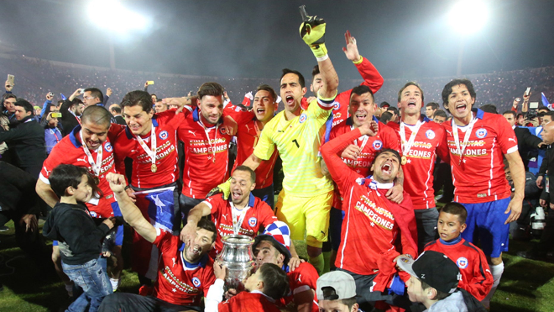July 4, 2015: Chile's players celebrate with the Copa America trophy after defeating Argentina in the final soccer match at the National Stadium in Santiago, Chile.