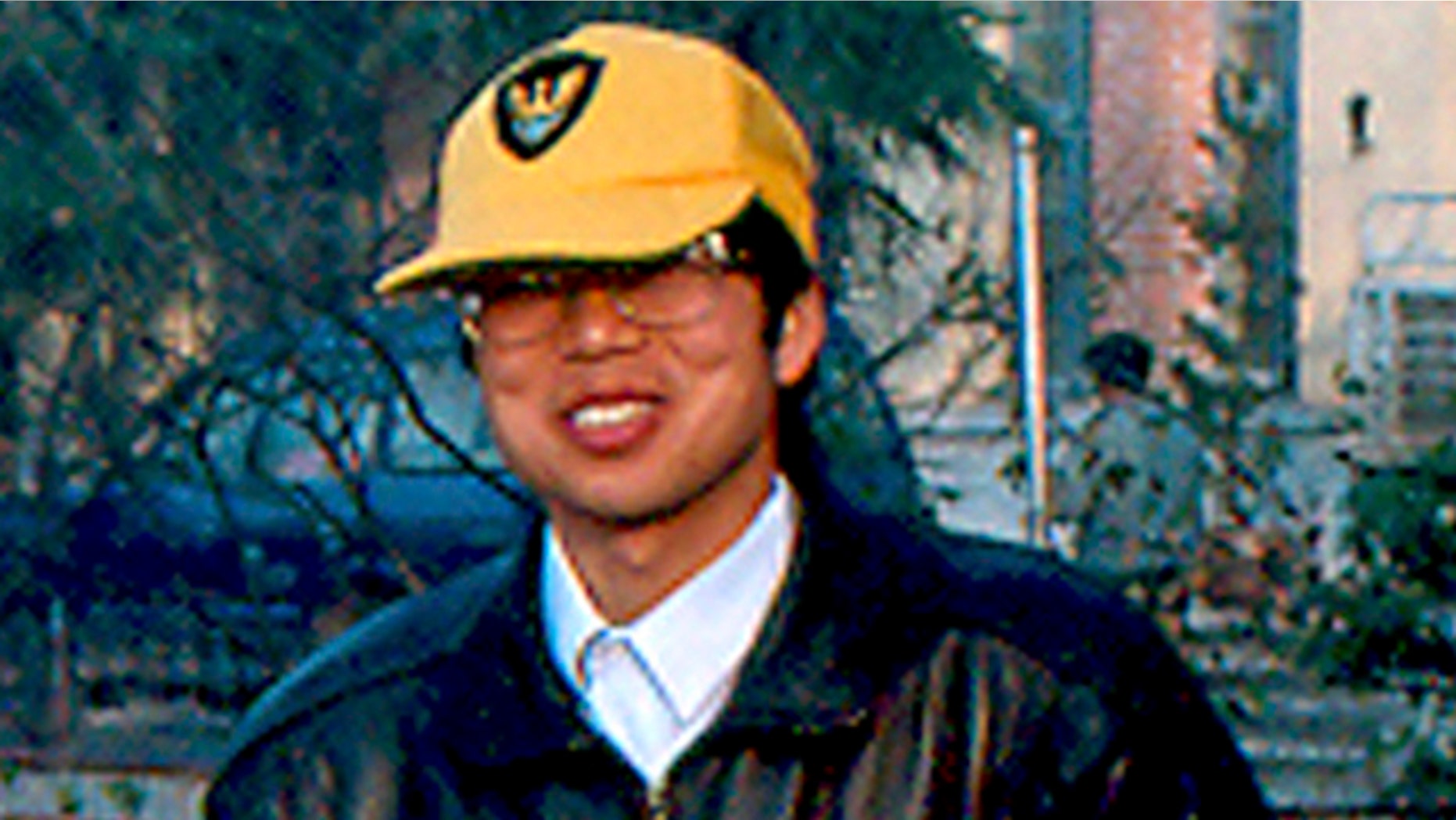 In this file photo released by David Rowley, taken Dec. 7, 1993 and made available Thursday, Nov. 19, 2009, Xue Feng poses for photos in Yuexi, Anhui province.