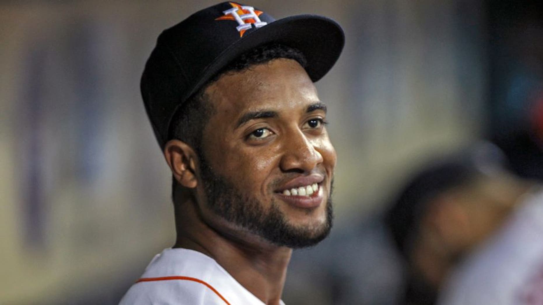 Jul 1, 2014; Houston, TX, USA; Houston Astros left fielder Domingo Santana (13) smiles in the dugout before a game against the Seattle Mariners at Minute Maid Park. Mandatory Credit: Troy Taormina-USA TODAY Sports