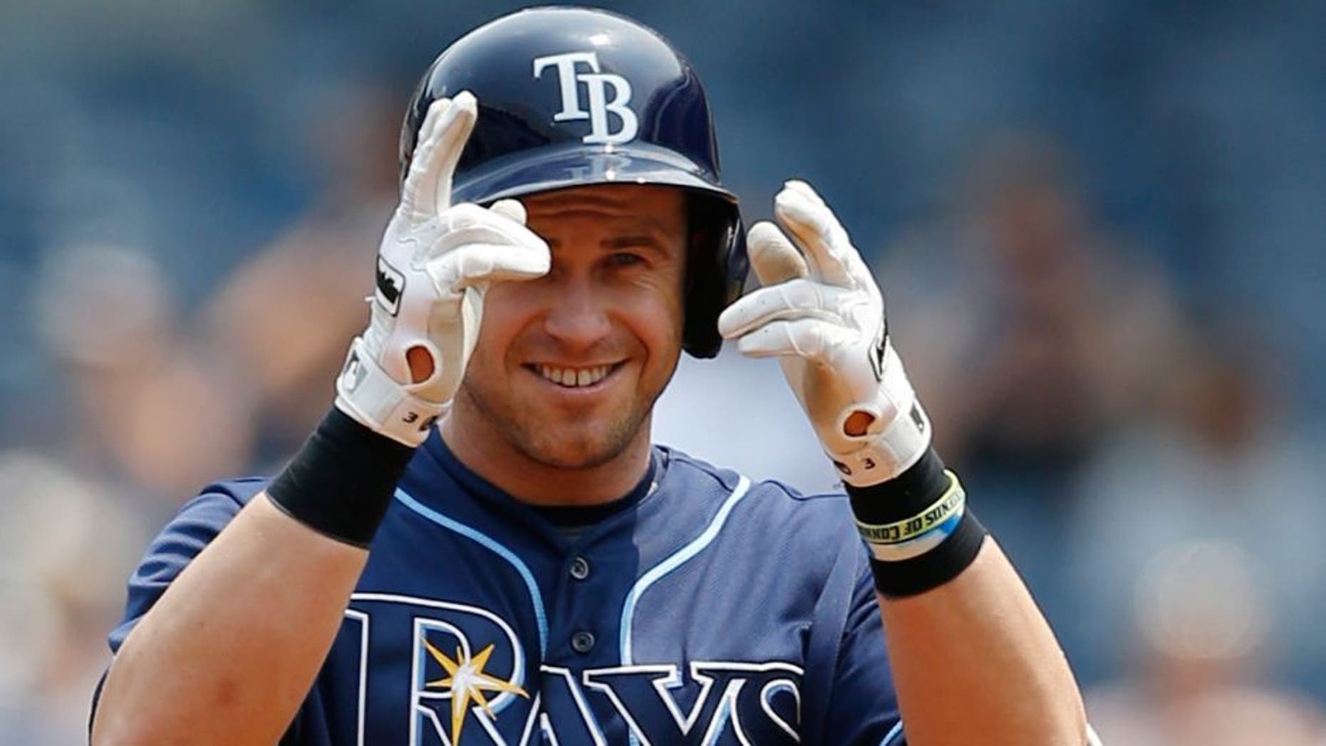 Tampa Bay Rays designated hitter Evan Longoria gestures toward the dugout after hitting a first-inning double in a baseball game against the New York Yankees at Yankee Stadium in New York, Sunday, July 5, 2015. (AP Photo/Kathy Willens)
